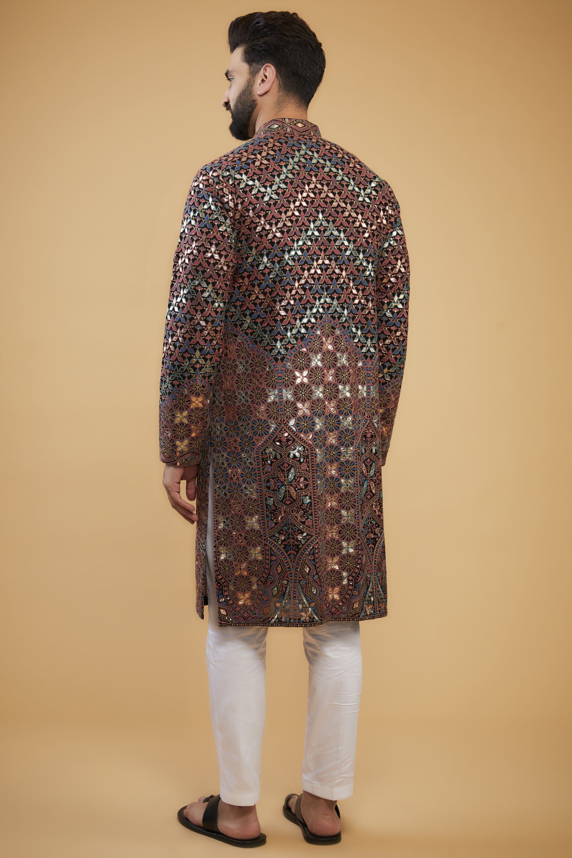 Black Chikankari kurta with intricate multi-thread work, detailed neckline and gold leather patch-work. - kasbahmen