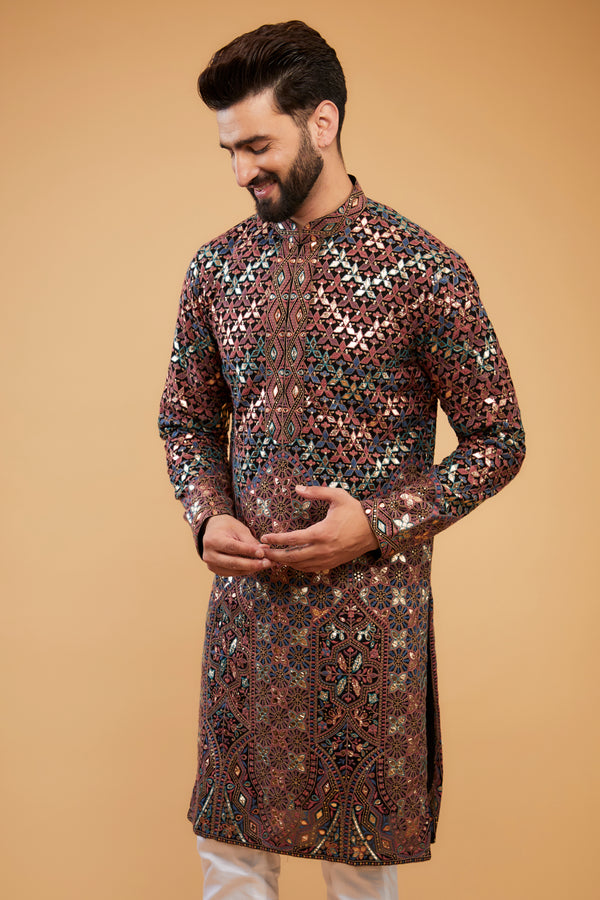 Black Chikankari kurta with intricate multi-thread work, detailed neckline and gold leather patch-work.