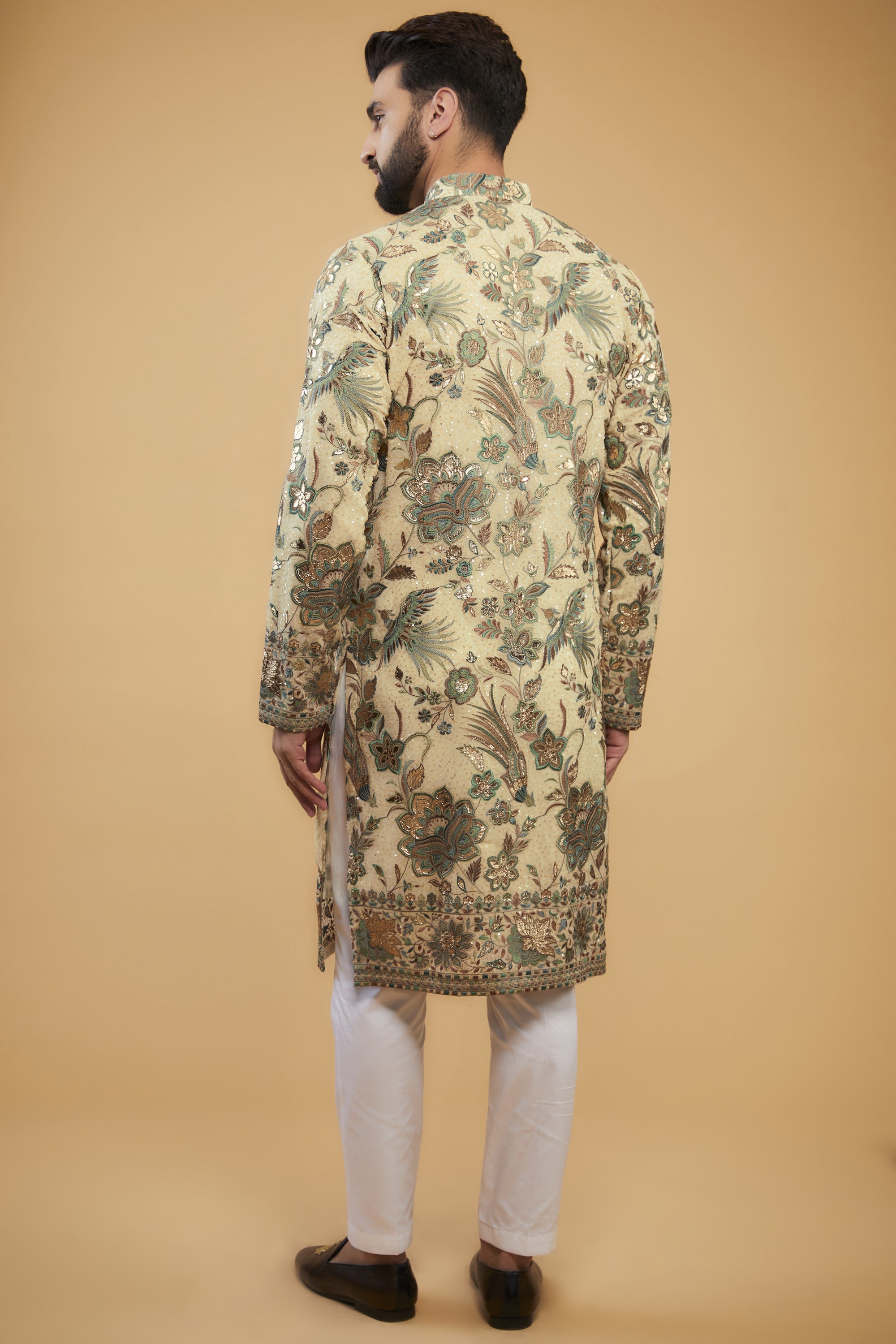 Cream Flora-Fauna Heavy embroidered kurta wuth intricate multi-threadwork in hues of green and gold leather patchwork - kasbahmen