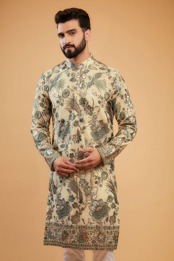 Cream Flora-Fauna Heavy embroidered kurta wuth intricate multi-threadwork in hues of green and gold leather patchwork