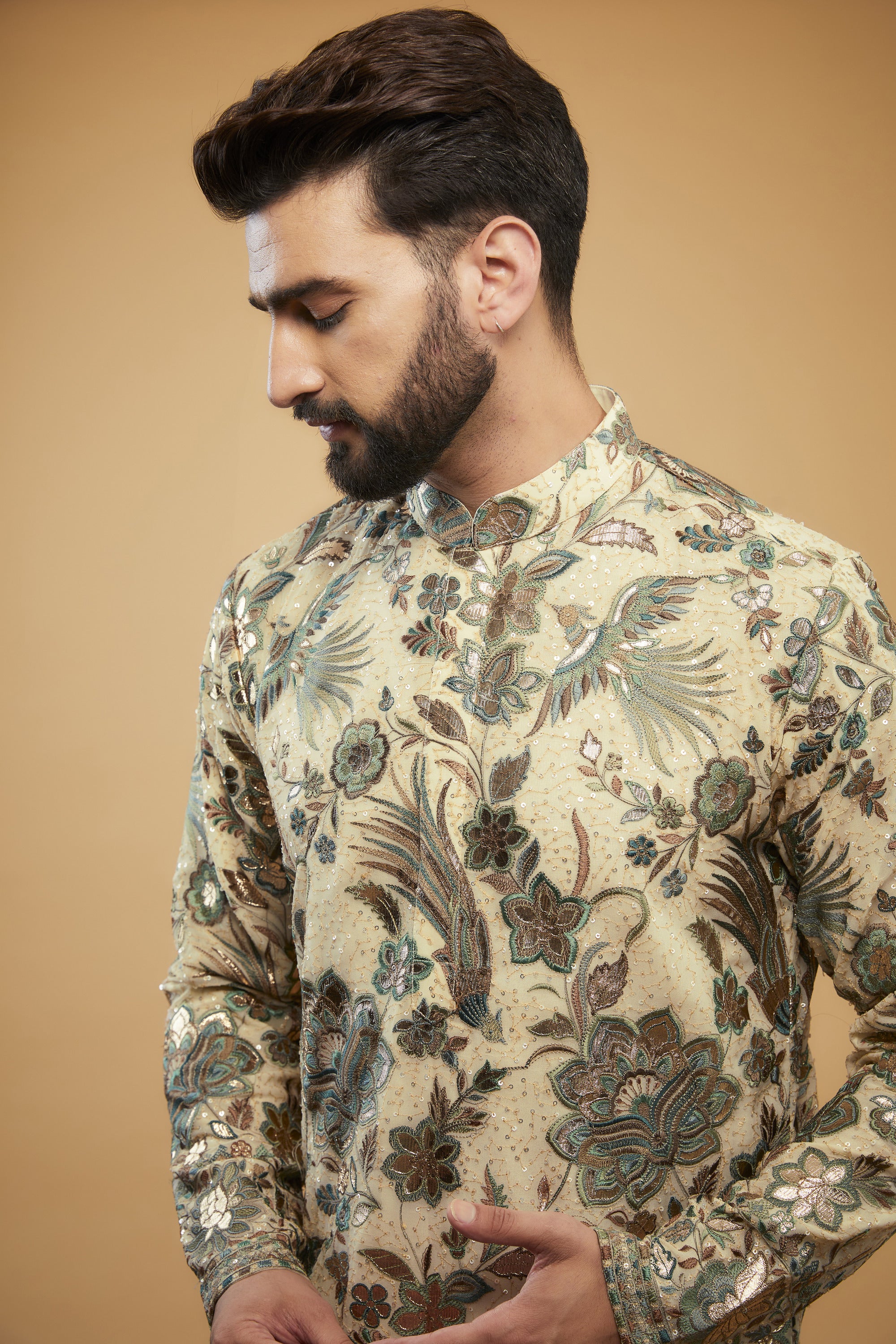 Cream Flora-Fauna Heavy embroidered kurta wuth intricate multi-threadwork in hues of green and gold leather patchwork - kasbahmen