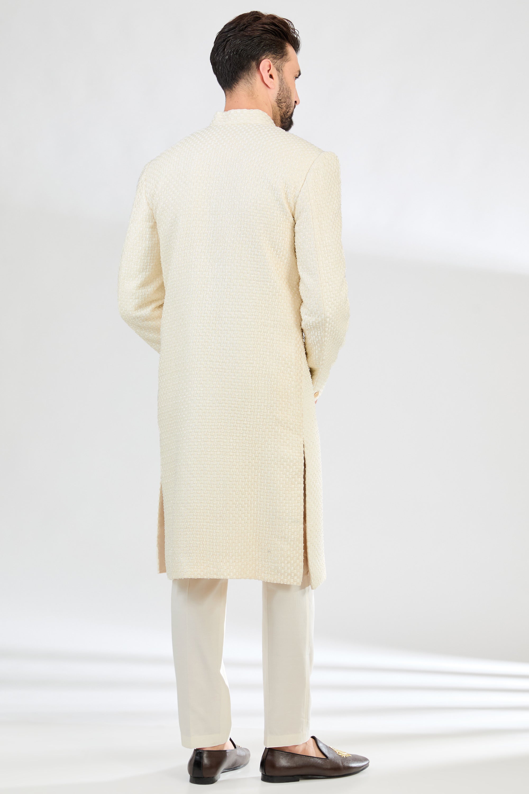 Classic Cream sherwani with detailed cut-dana and heavy thread work. - kasbahmen