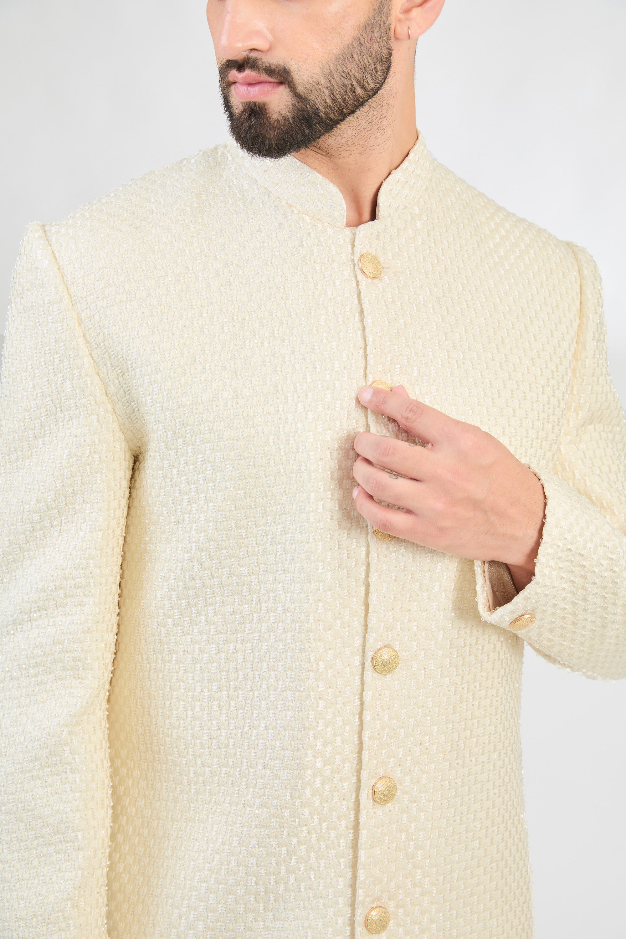 Classic Cream sherwani with detailed cut-dana and heavy thread work. - kasbahmen