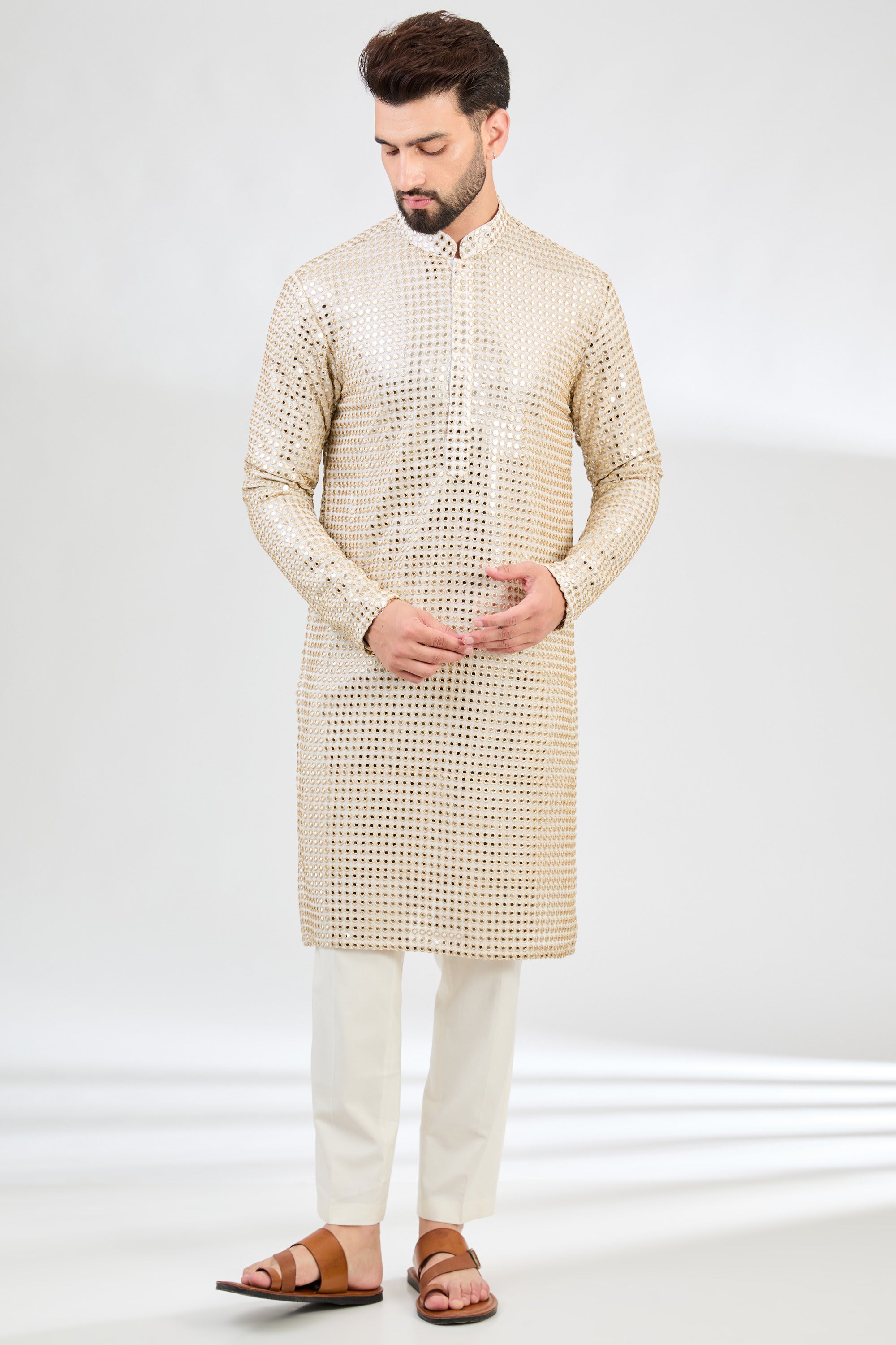 Cream mirror-work kurta with intricate golden zari detailing. - kasbahmen