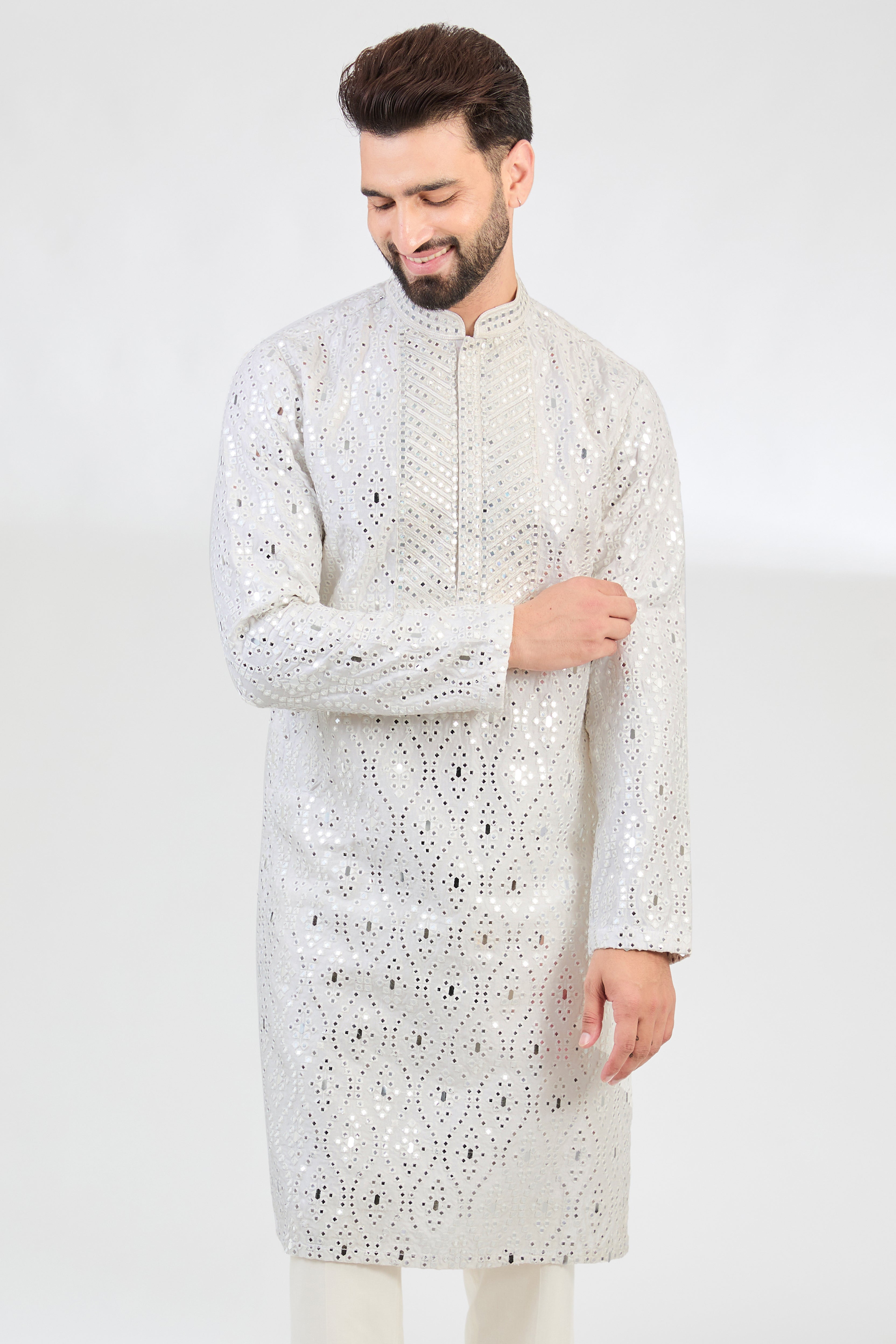 White mirror-work kurta with intricate hand embroidered neckline. - kasbahmen