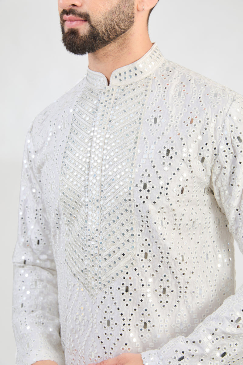 White mirror-work kurta with intricate hand embroidered neckline. - kasbahmen