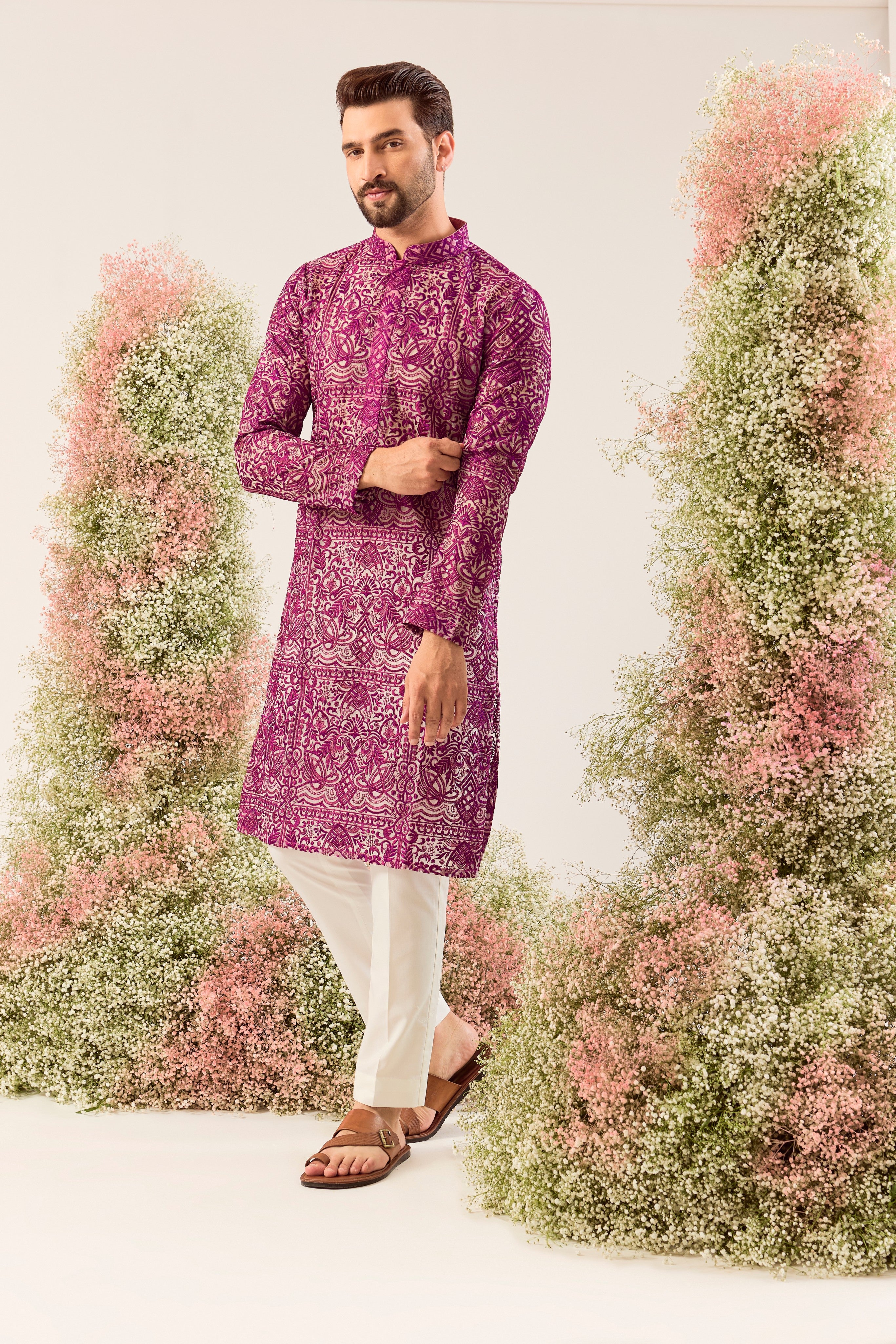 Radiate pure elegance in this magenta long kurta. The see through, intricate Chikankari work tells a story of tradition and grace, creating a look that's both captivating and timeless. It's the perfect blend of modern allure and classic artistry.