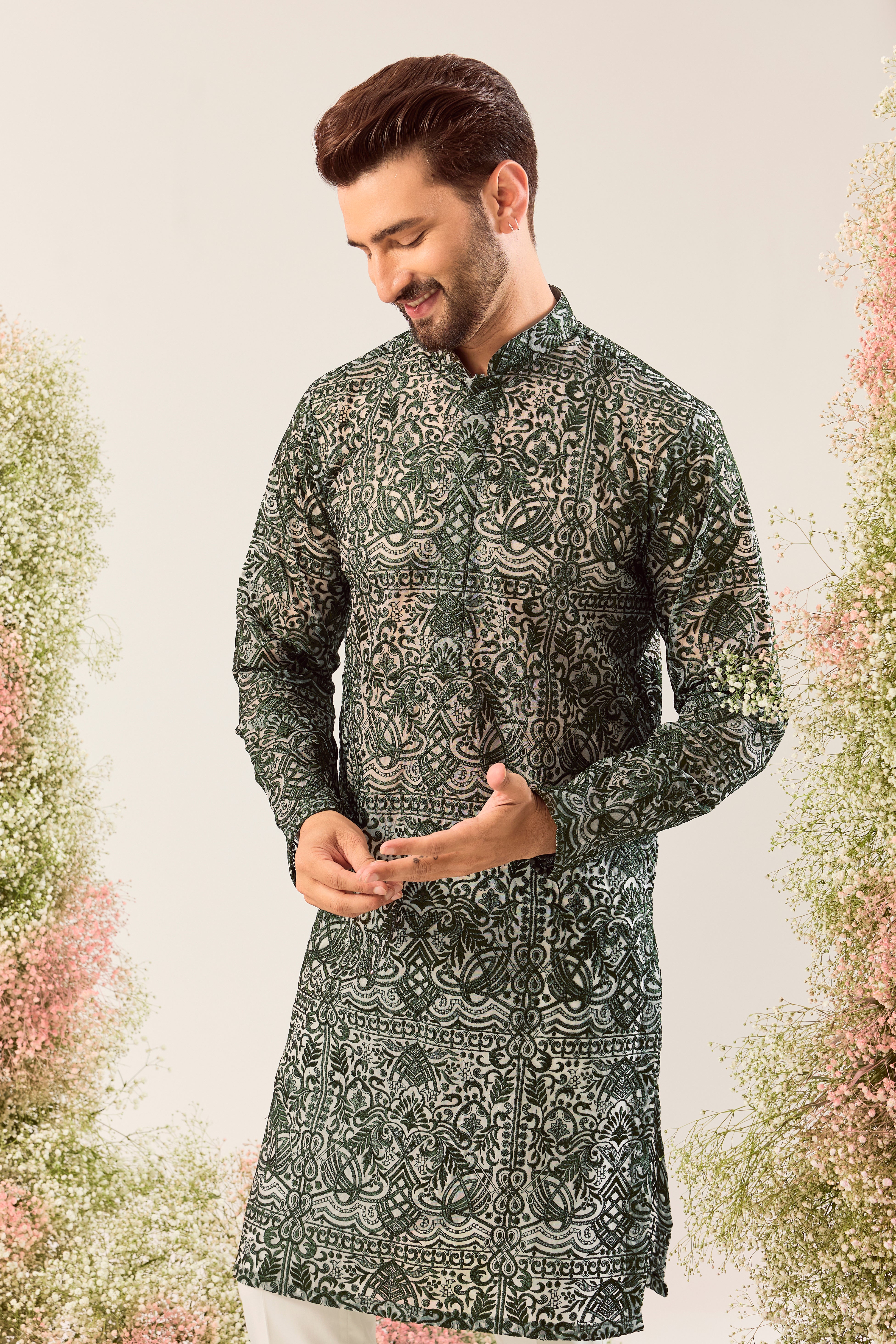 Radiate pure elegance in this emerald green long kurta. The see through, intricate Chikankari work tells a story of tradition and grace, creating a look that's both captivating and timeless. It's the perfect blend of modern allure and classic artistry.