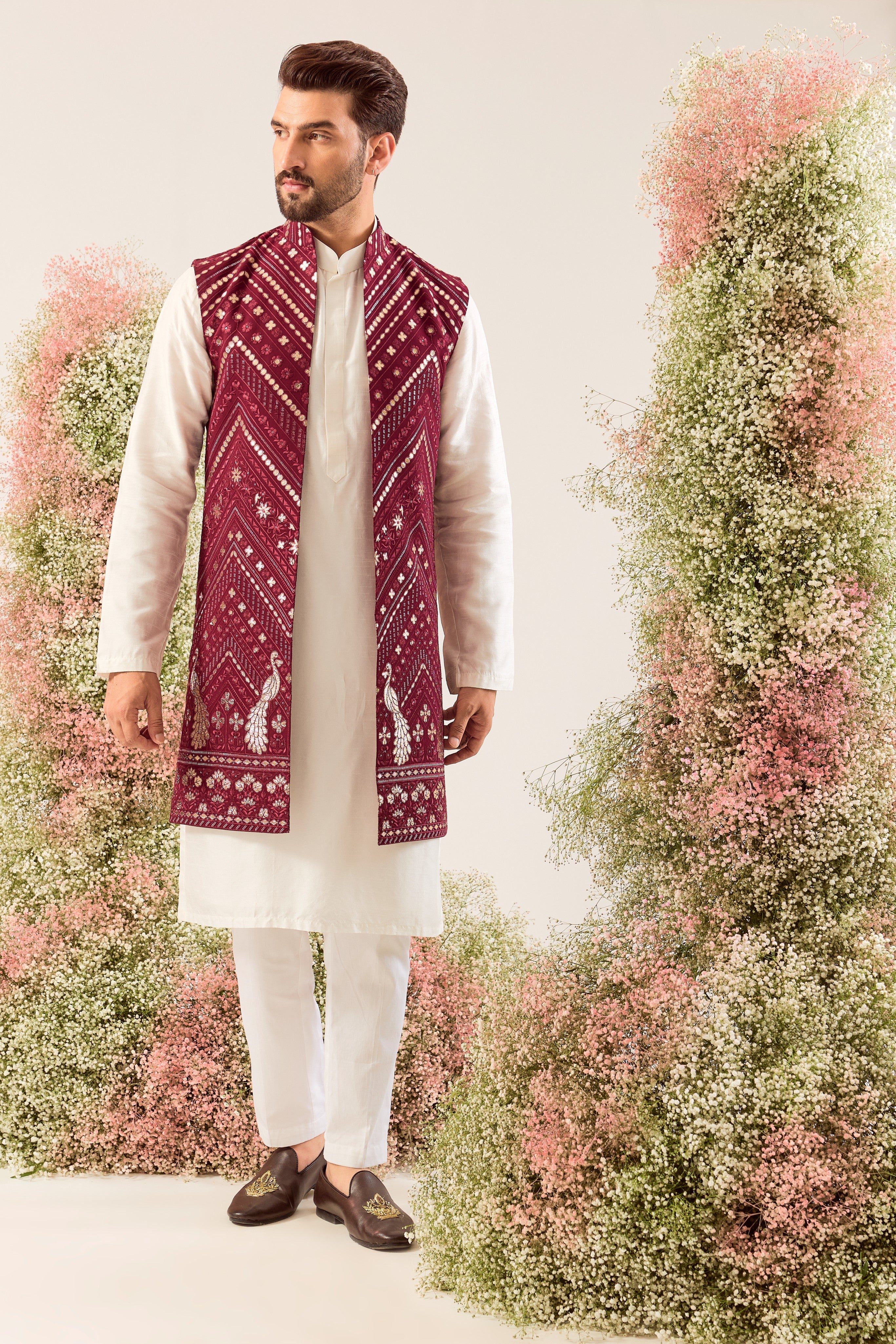 magenta long open jacket with detailed leather patchwork and peacock motifs