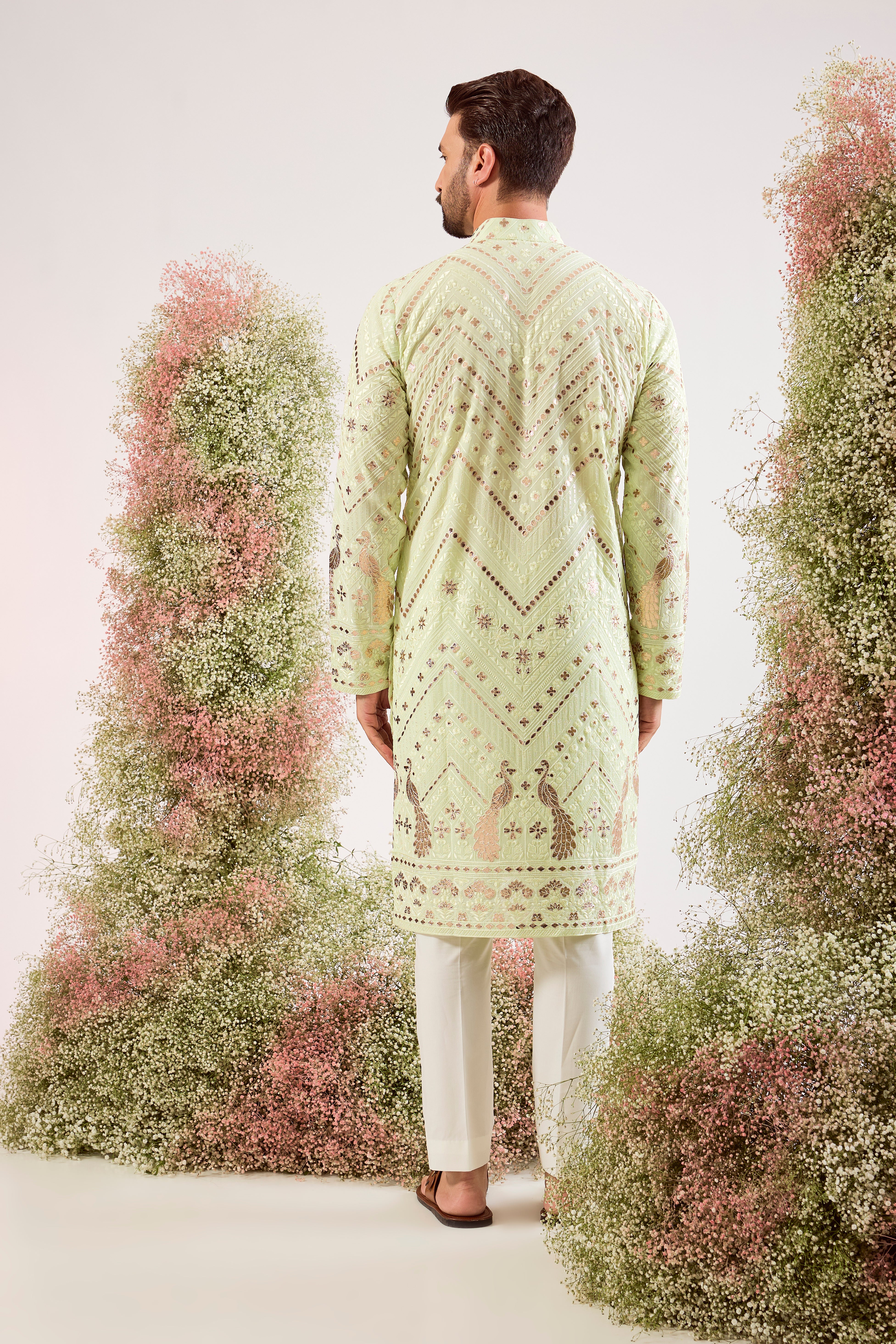 pastel green leather patchowk kurta with intricate peacock motifs