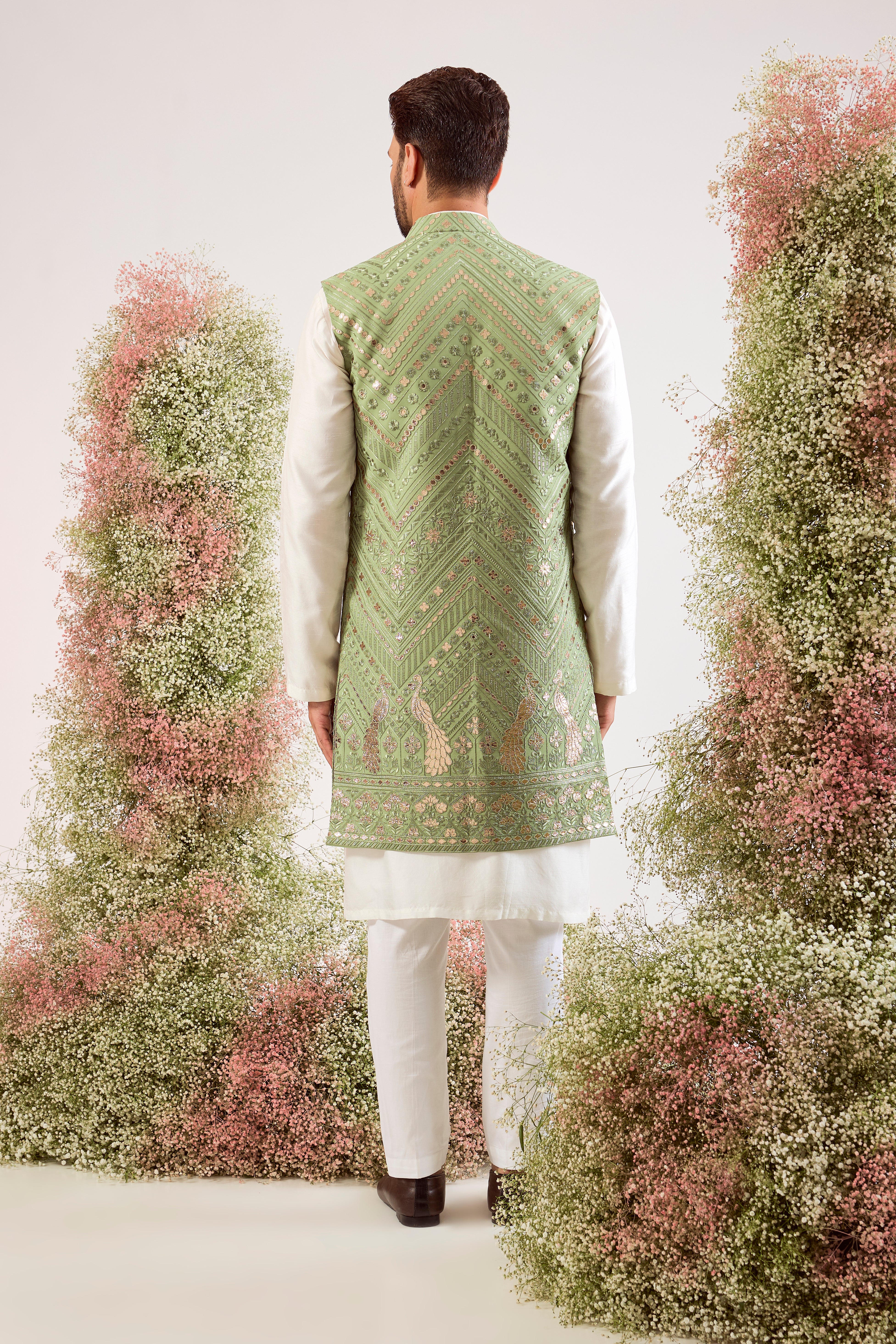 sage green leather patchwork long open jacket with peacock motifs