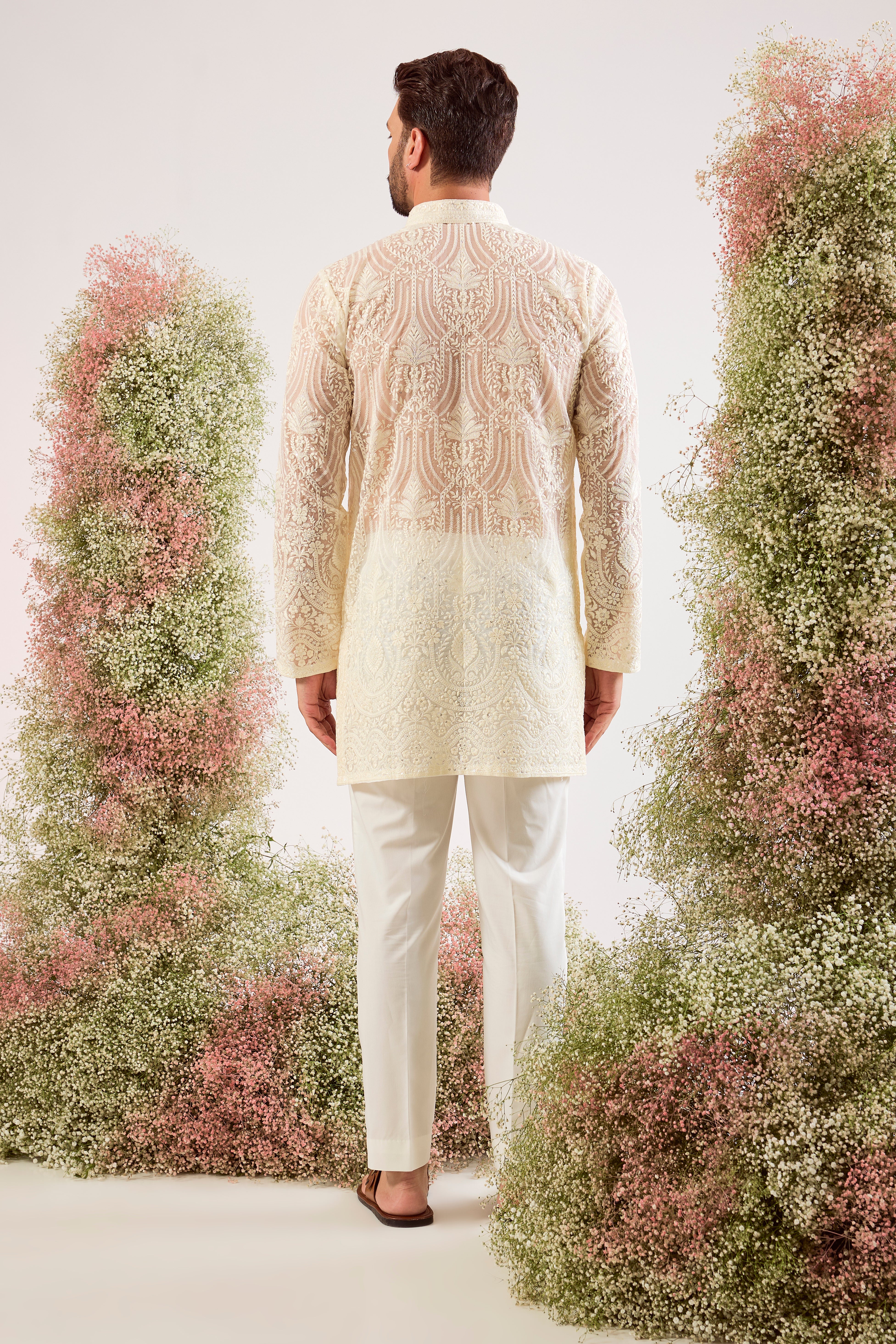 white  short see through chickankari kurta with intricate sequin embroidery