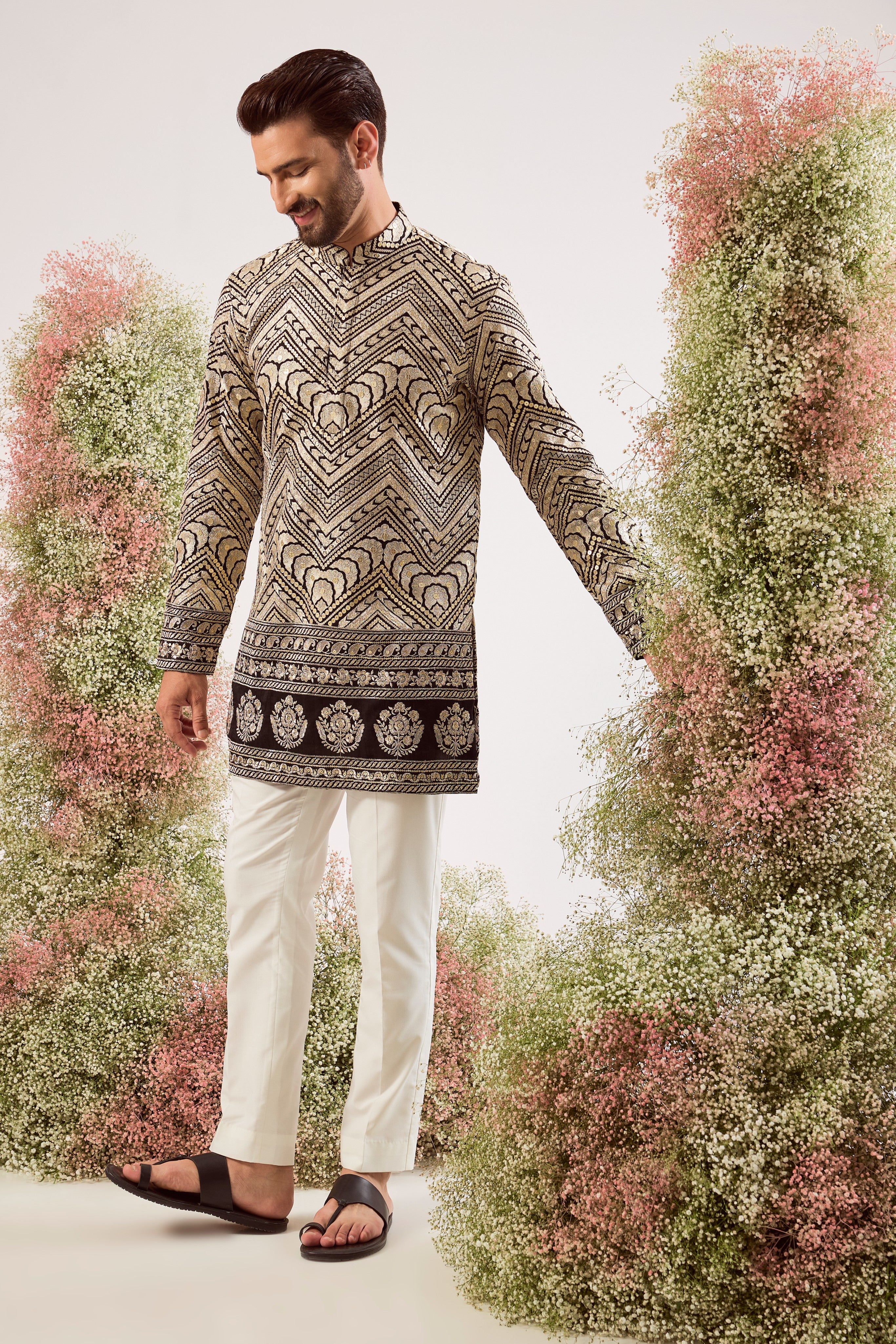 black short zari kurta with golden thread work and sequin details