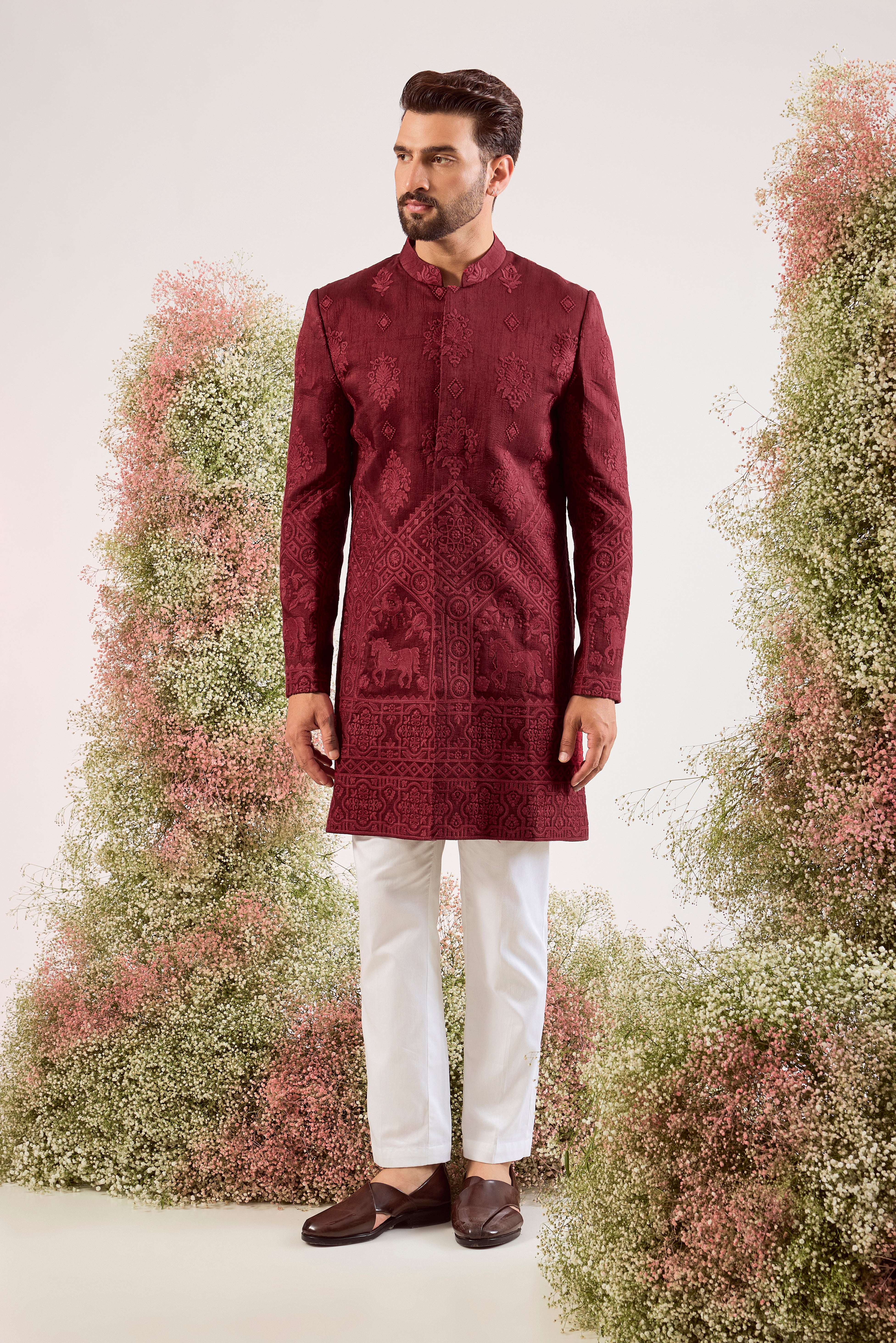 maroon short chikankari sherwani with intricate horse figures and tone to tone threadwork