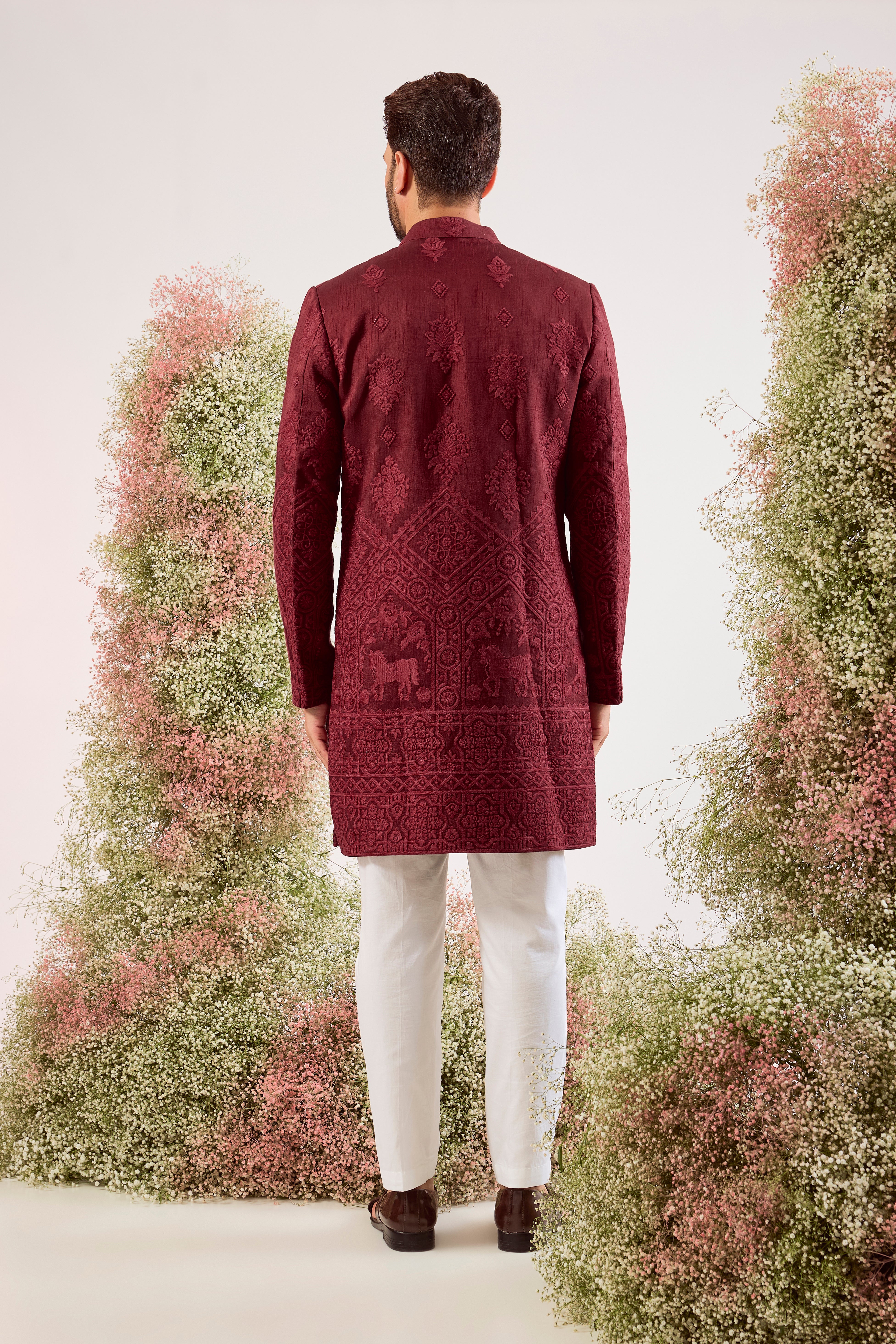 maroon short chikankari sherwani with intricate horse figures and tone to tone threadwork
