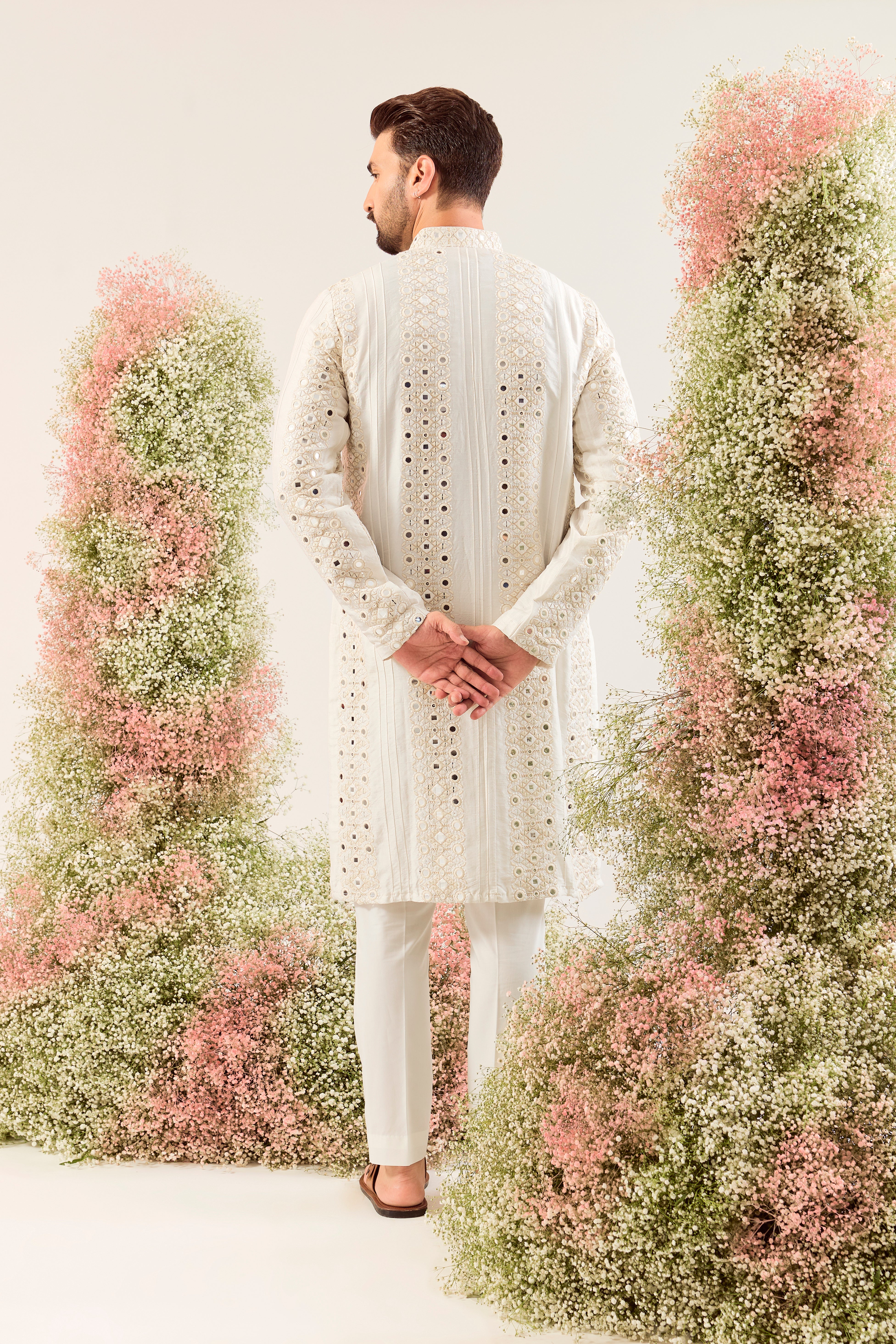 white mirror work kurta with deatiled pintucks and neckline