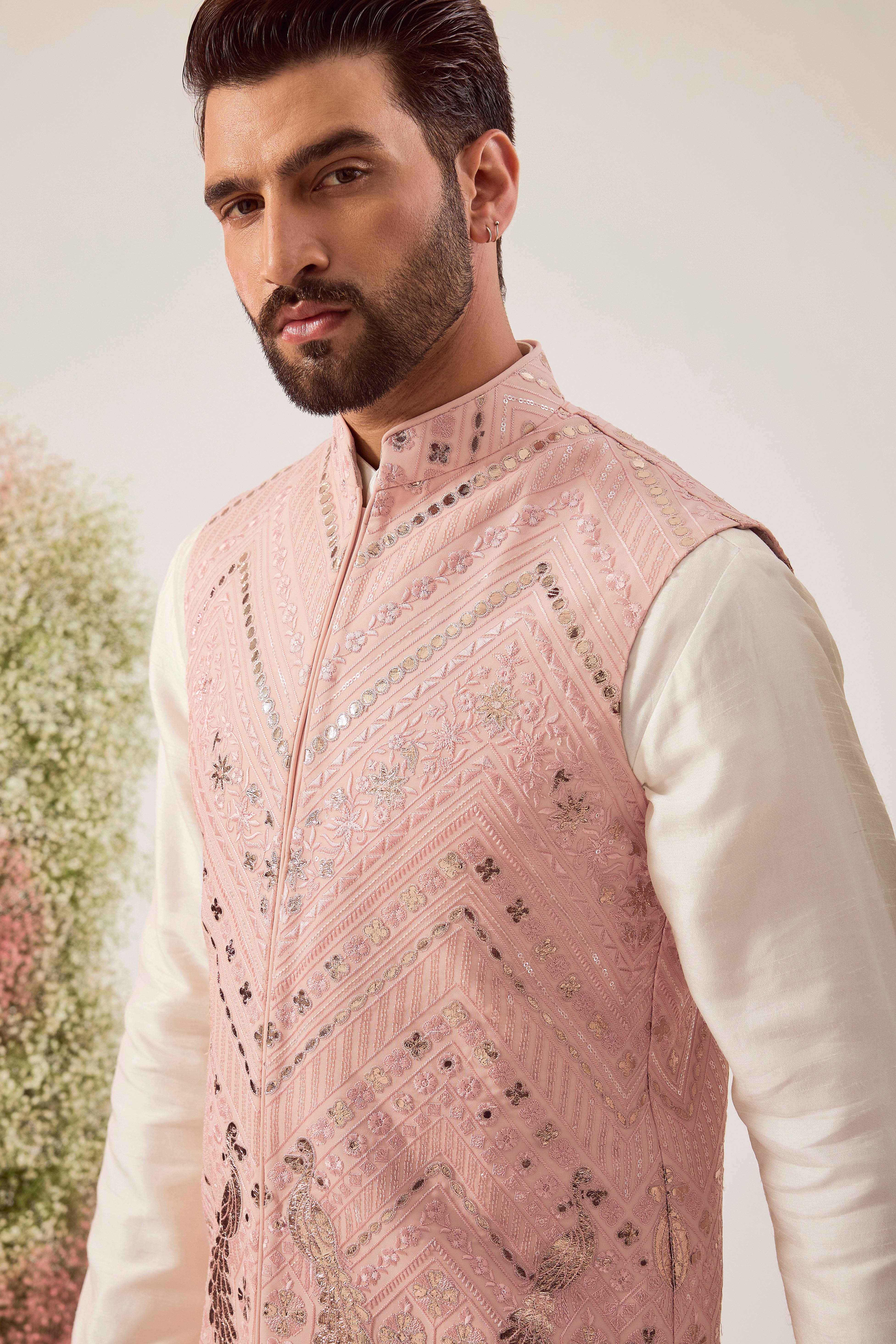 peach leather patchwork jacket with intricate peacock motifs