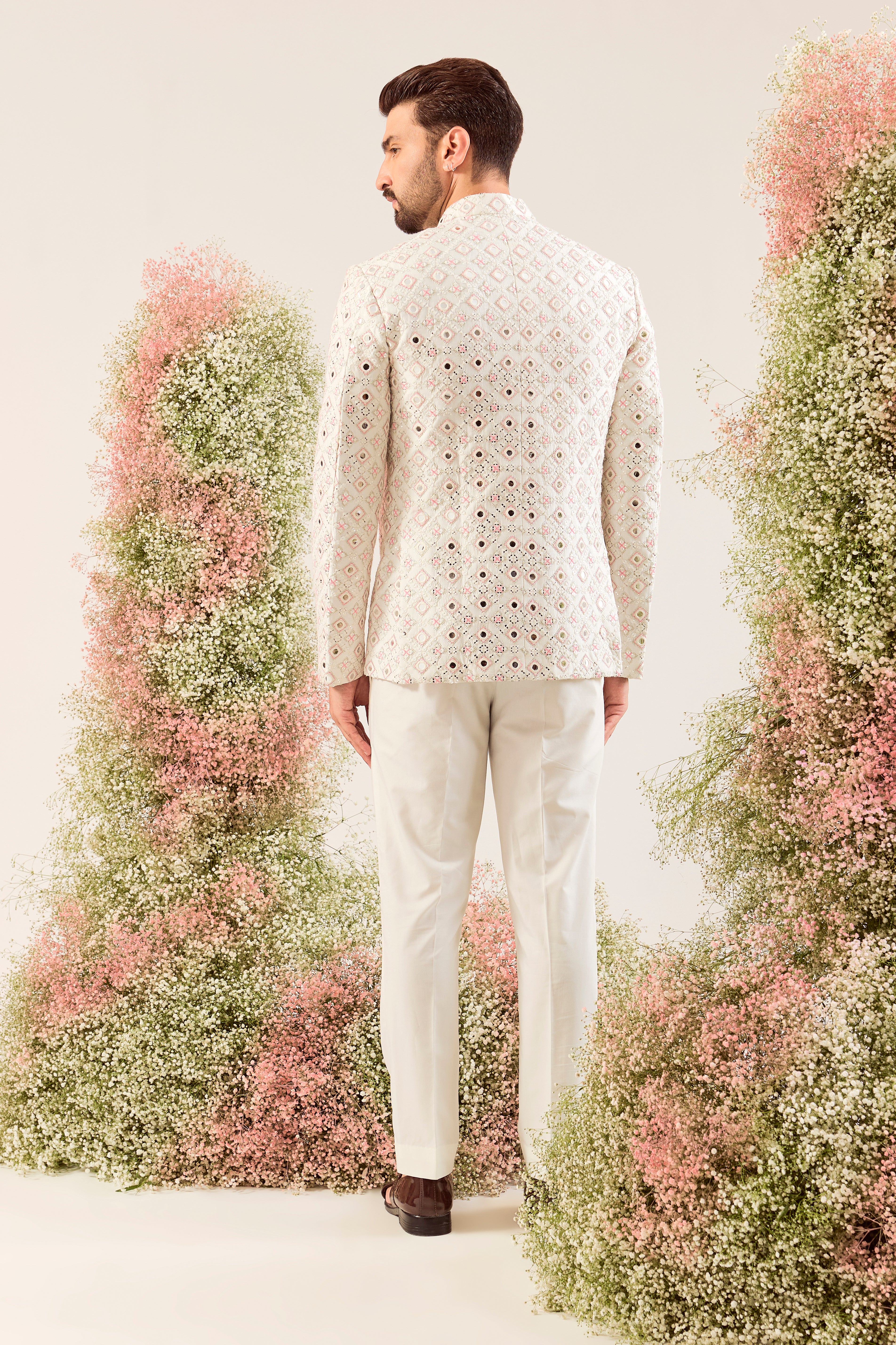 our signature white mirror work bandgala with intricate peach thread work and sequin details