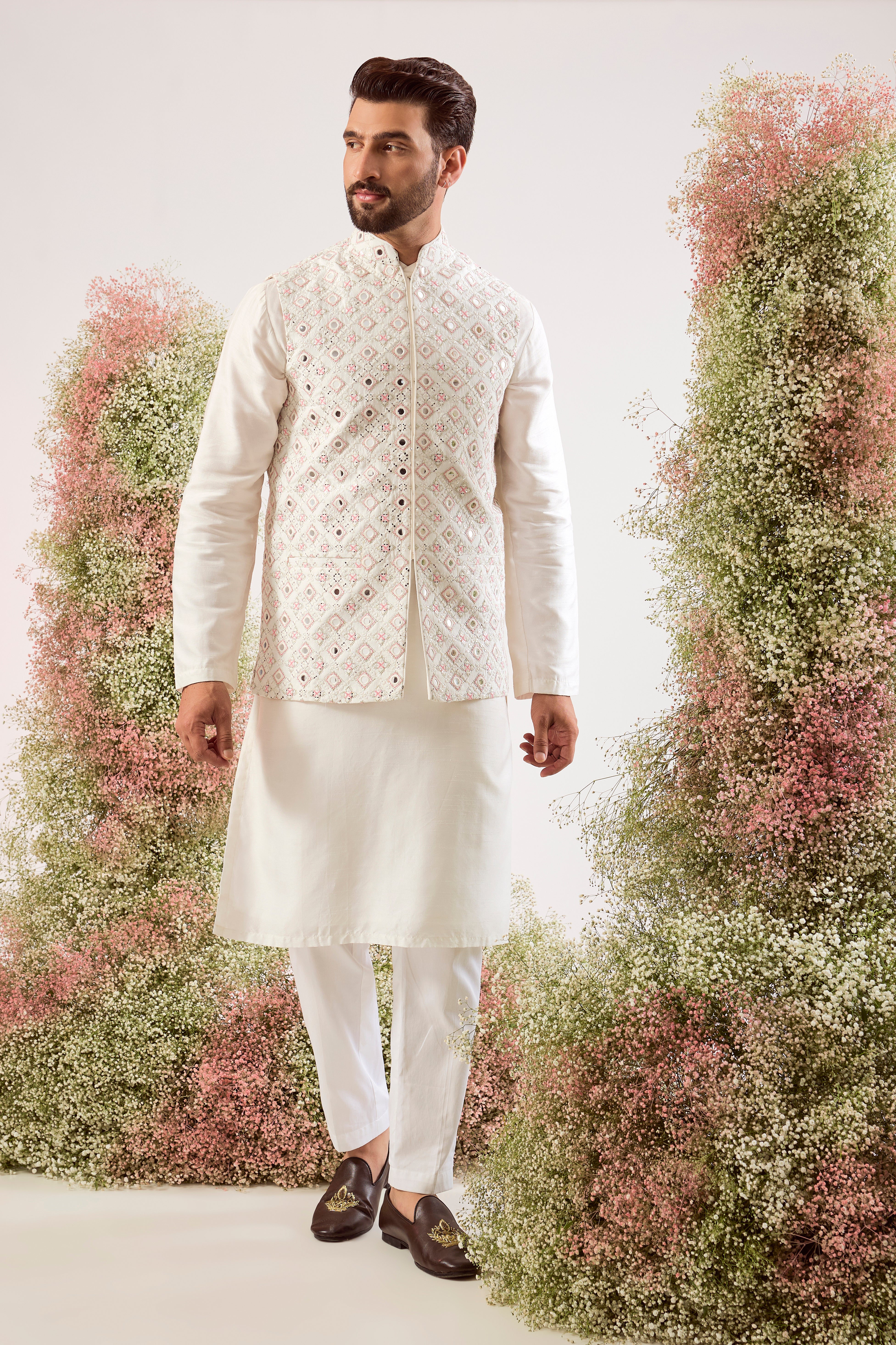 white mirror work jacket with intricate pink thread work and sequin details