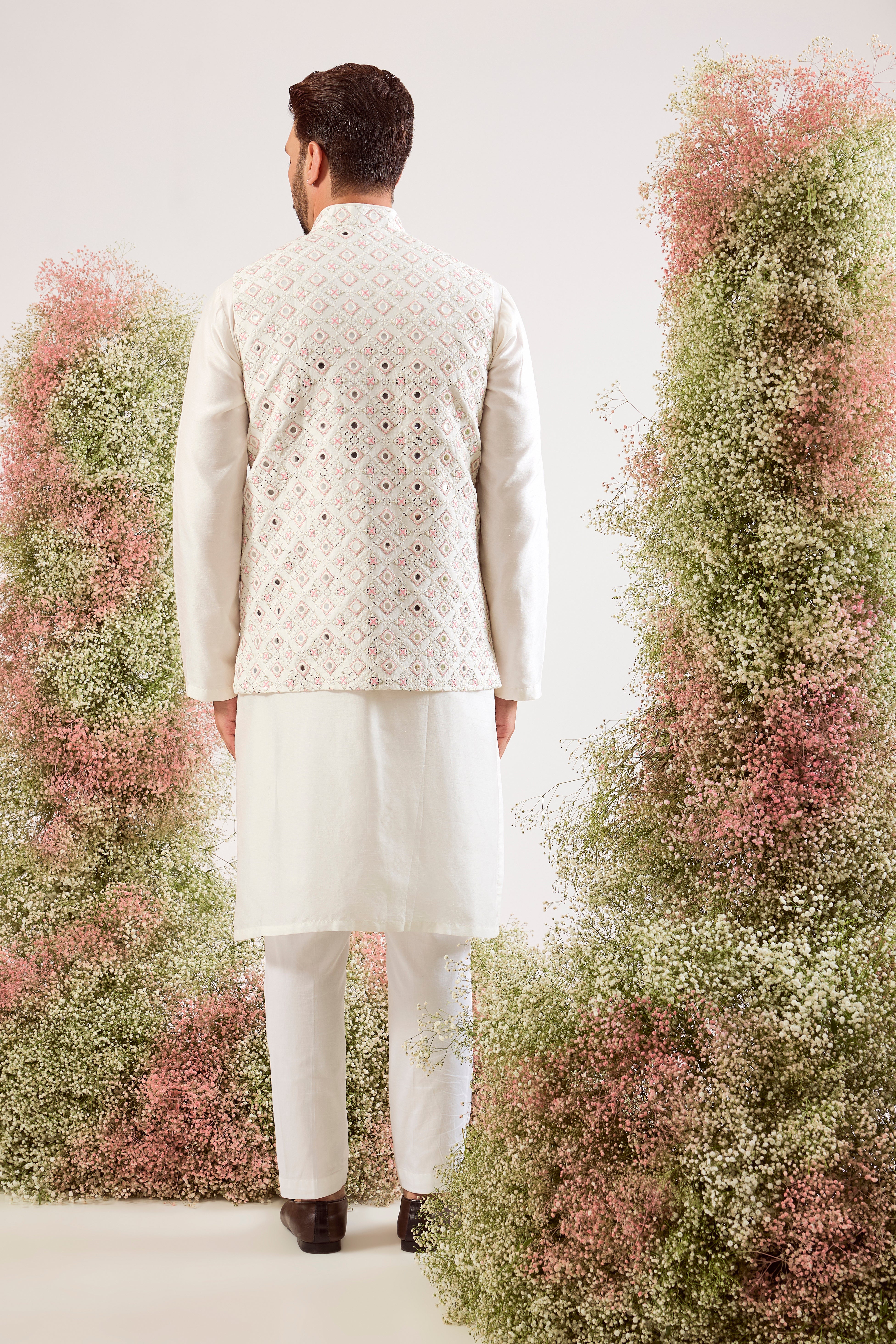 white mirror work jacket with intricate pink thread work and sequin details