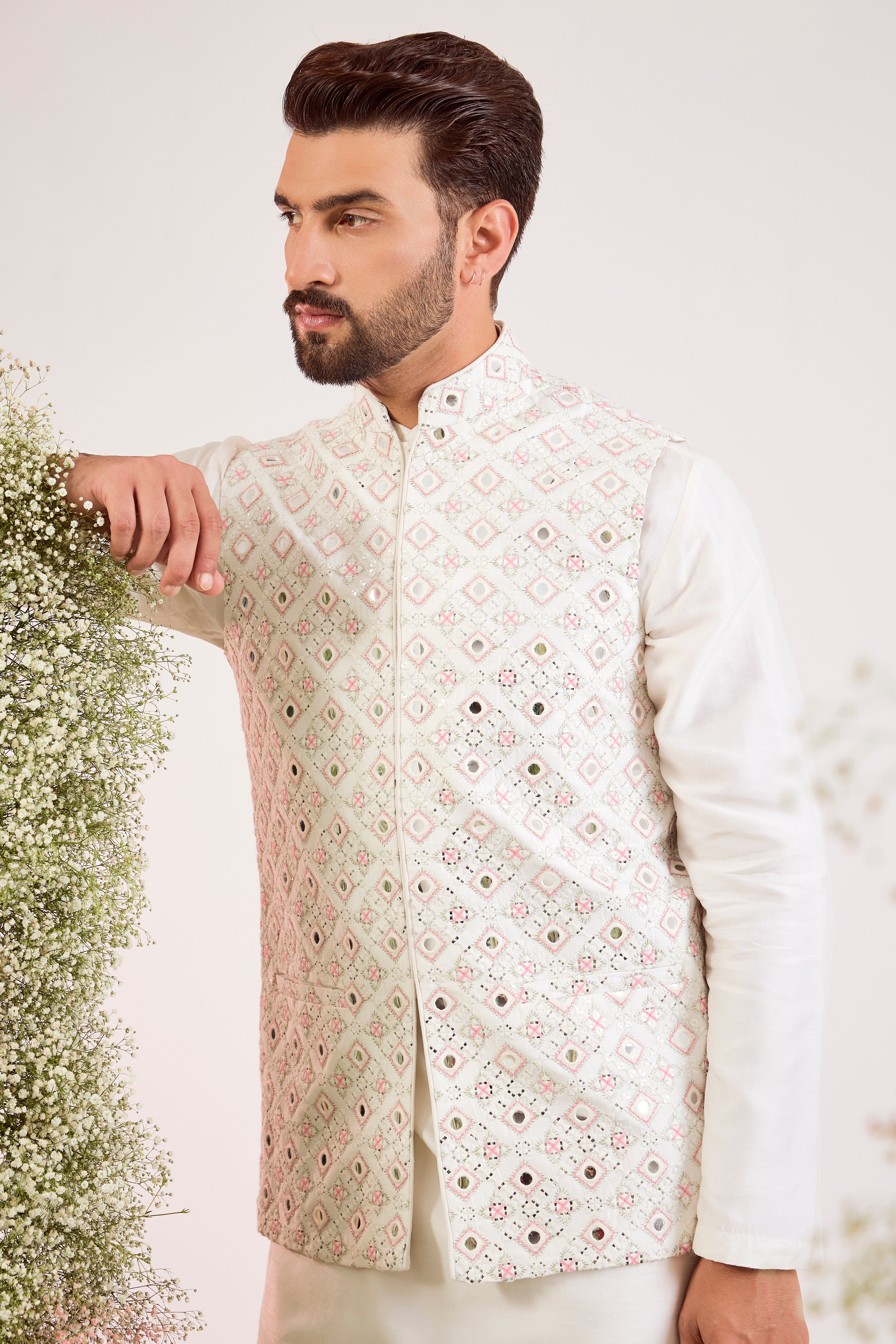 white mirror work jacket with intricate pink thread work and sequin details