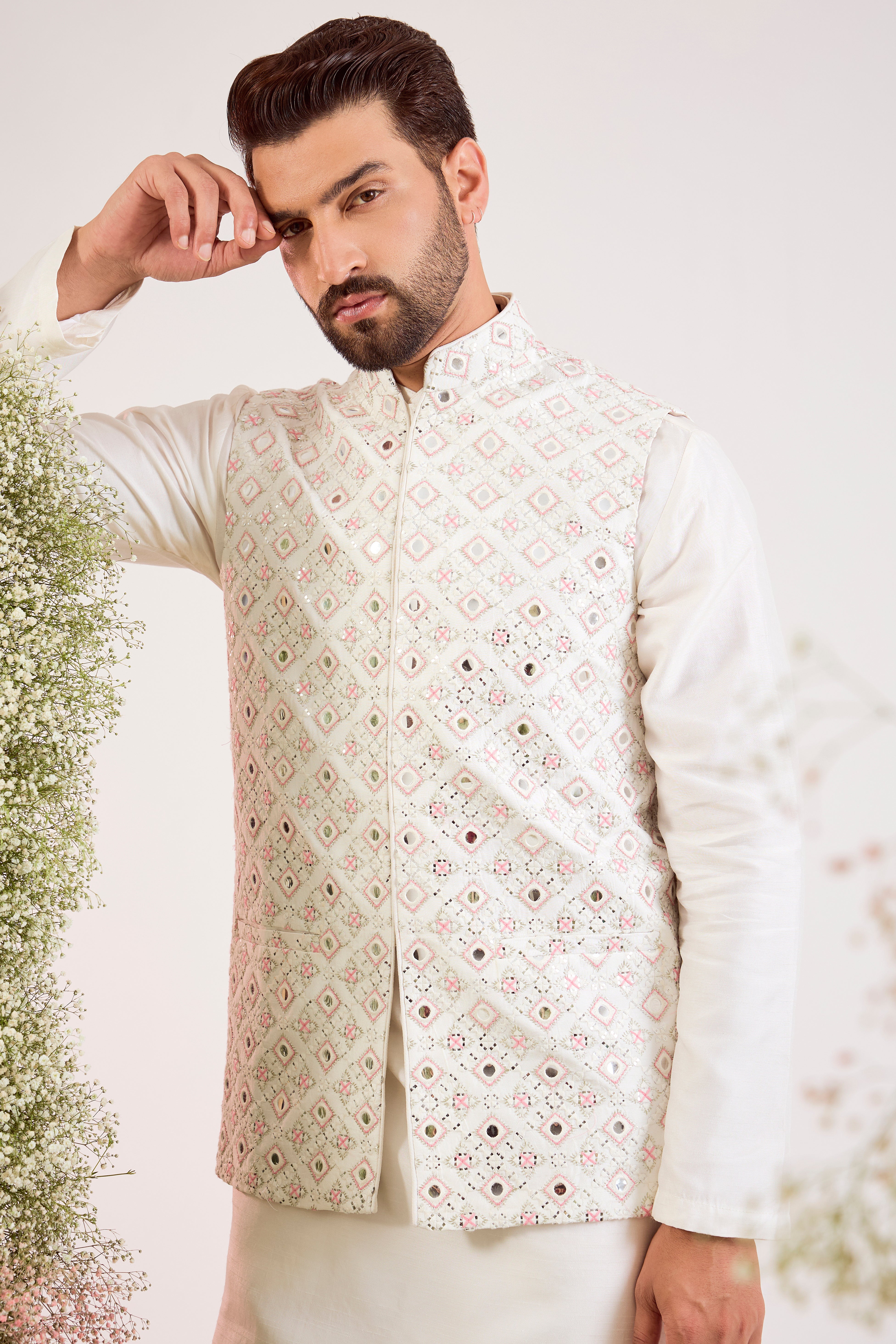 white mirror work jacket with intricate pink thread work and sequin details