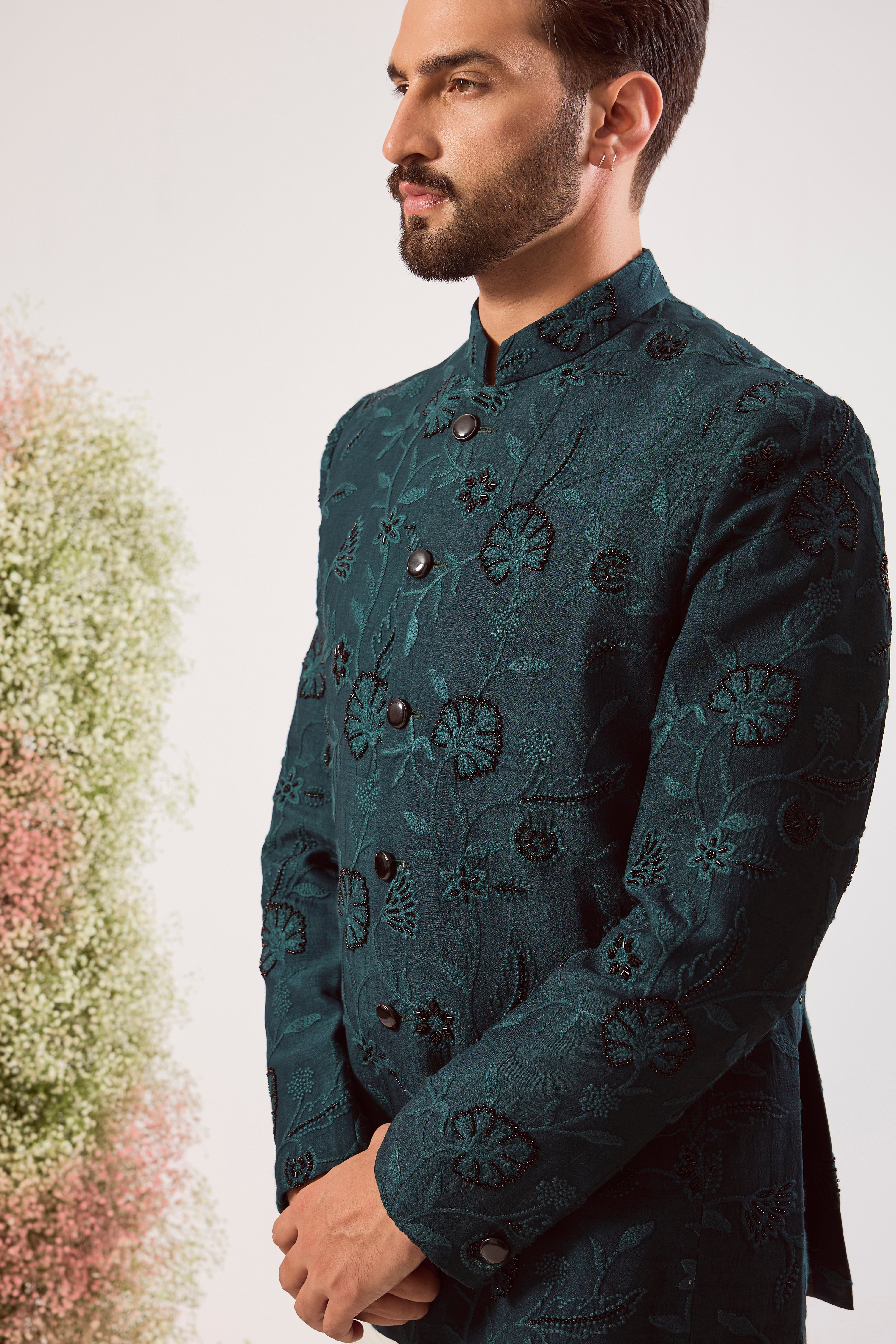 teal bandgala with intricate floral embroidery and sleek black cut dana work