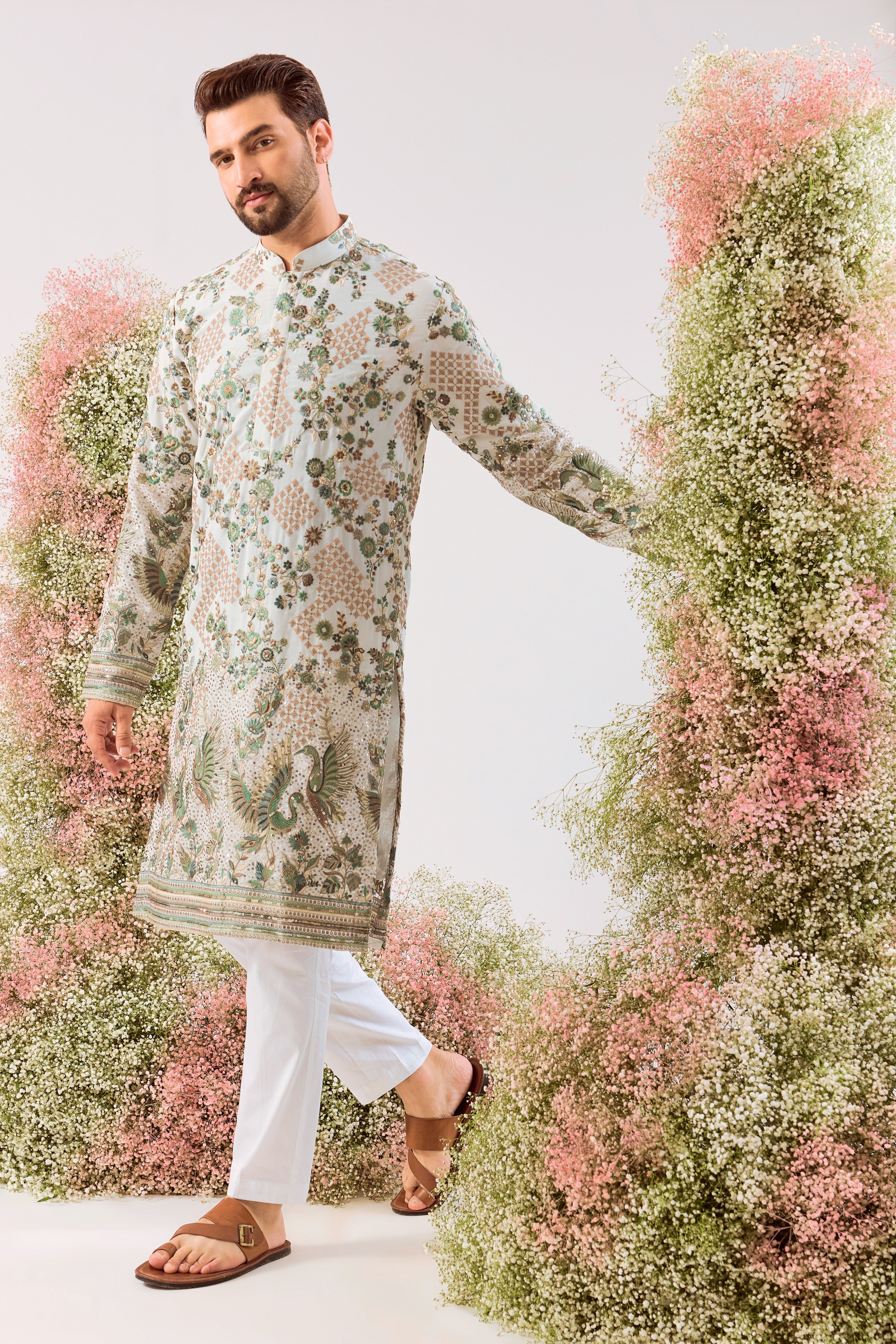 white sequined kurta with intricate flora and fauna embroidery
