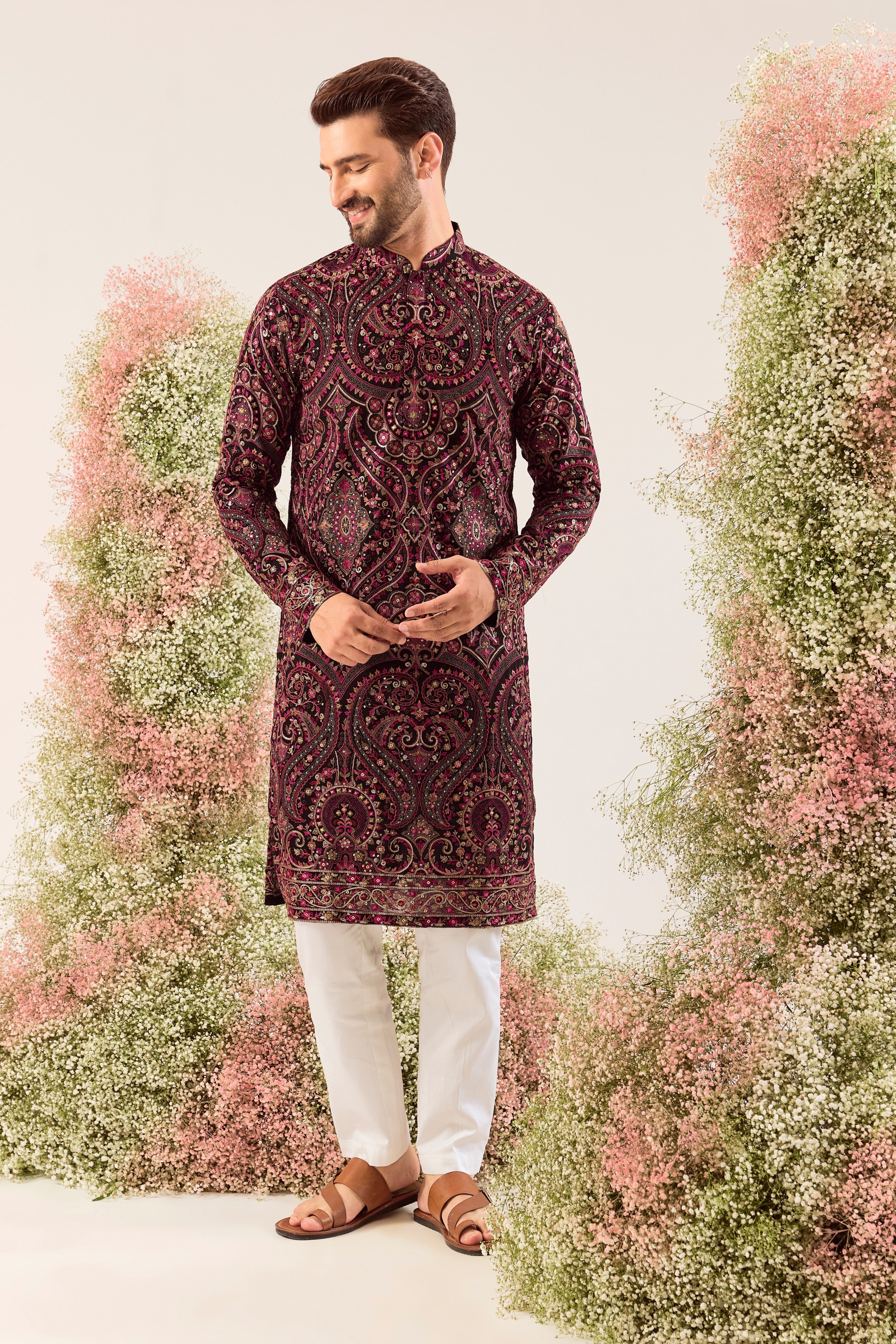 This elegant black Kashmiri chikankari kurta is a masterpiece of traditional artistry.