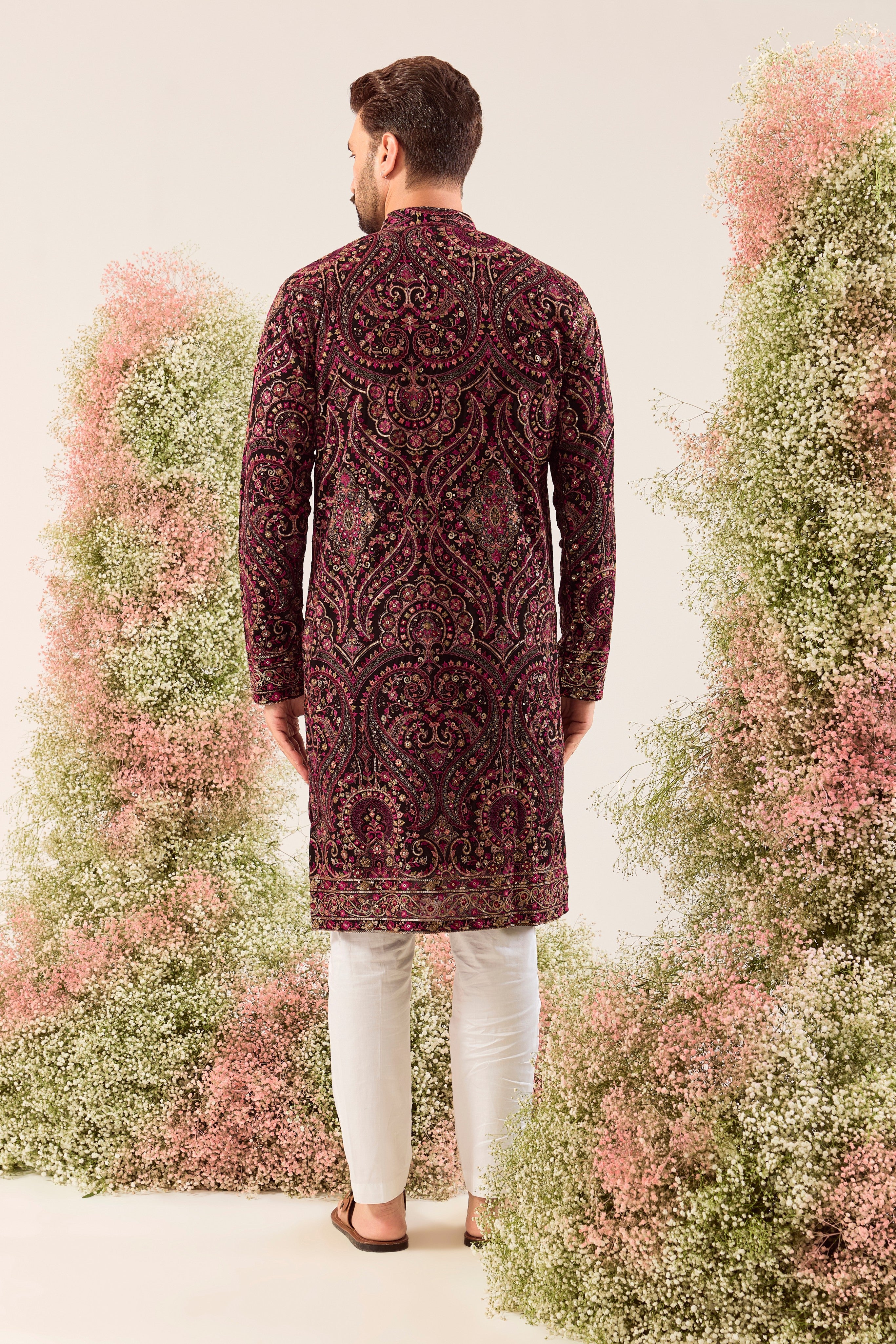 This elegant black Kashmiri chikankari kurta is a masterpiece of traditional artistry.