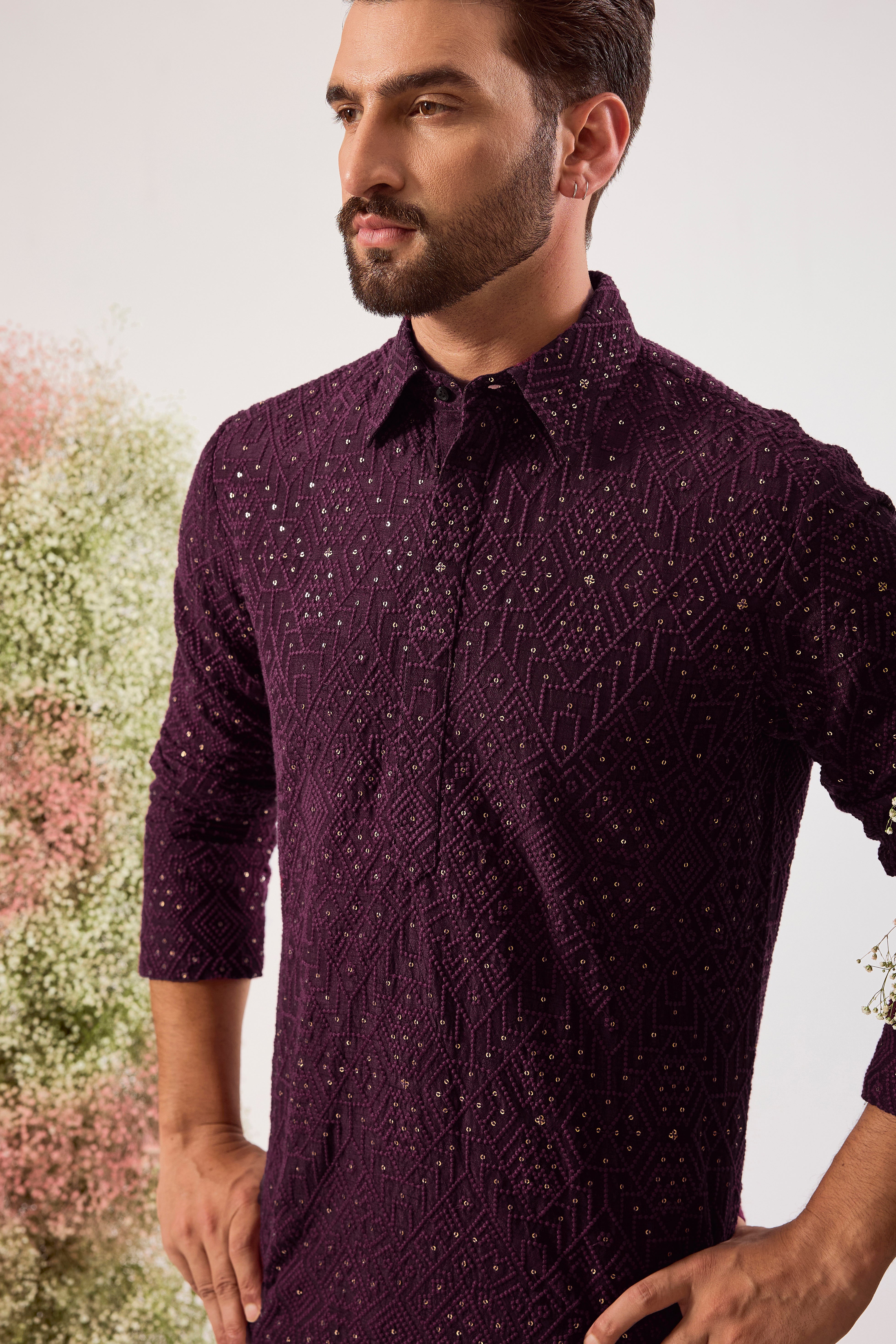 This elegant wine geometrically embroidered short pathani kurta is a masterpiece of modern design.