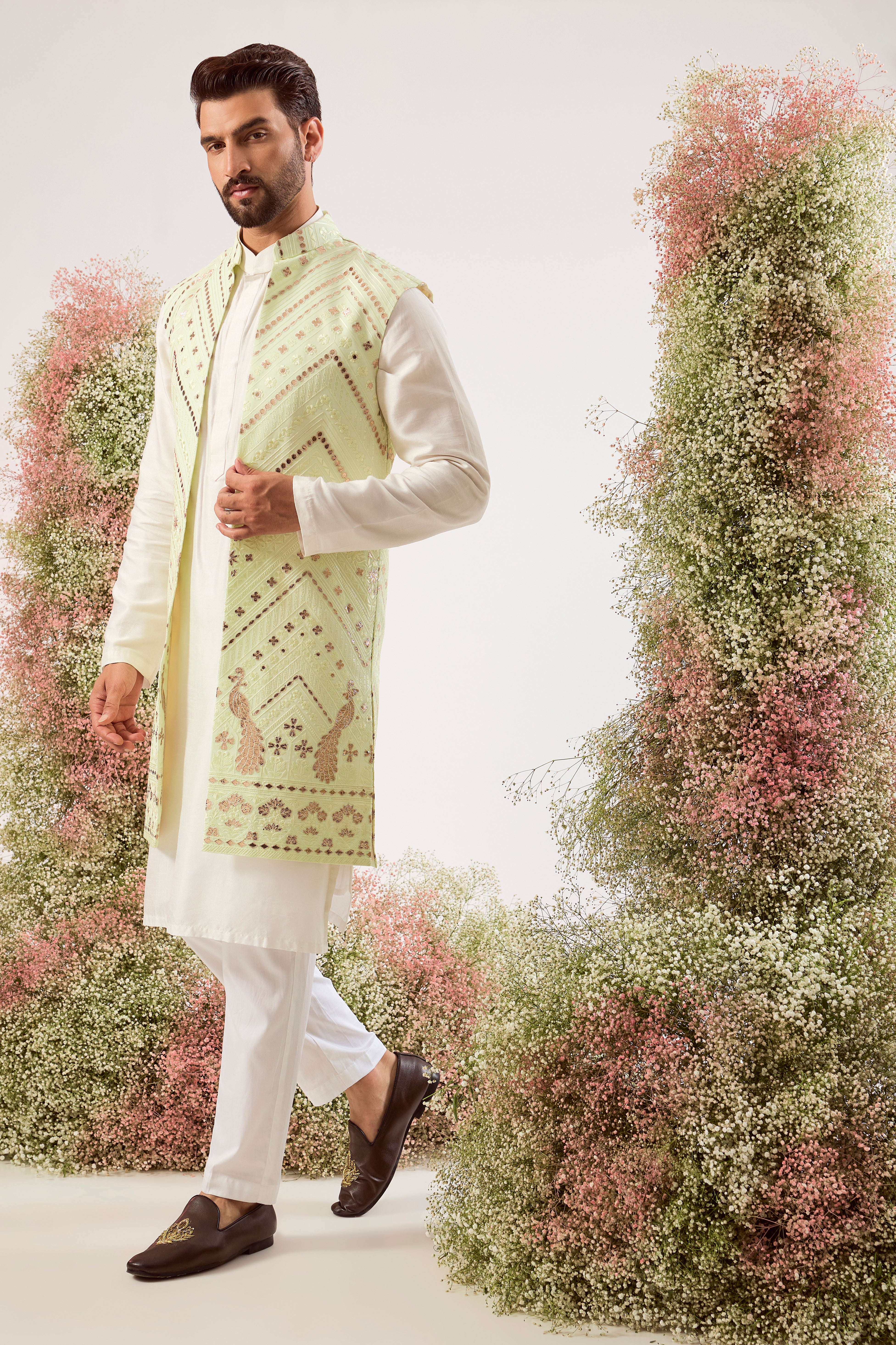 This magnificent green leather patchwork long open jacket is a true masterpiece of modern artistry.