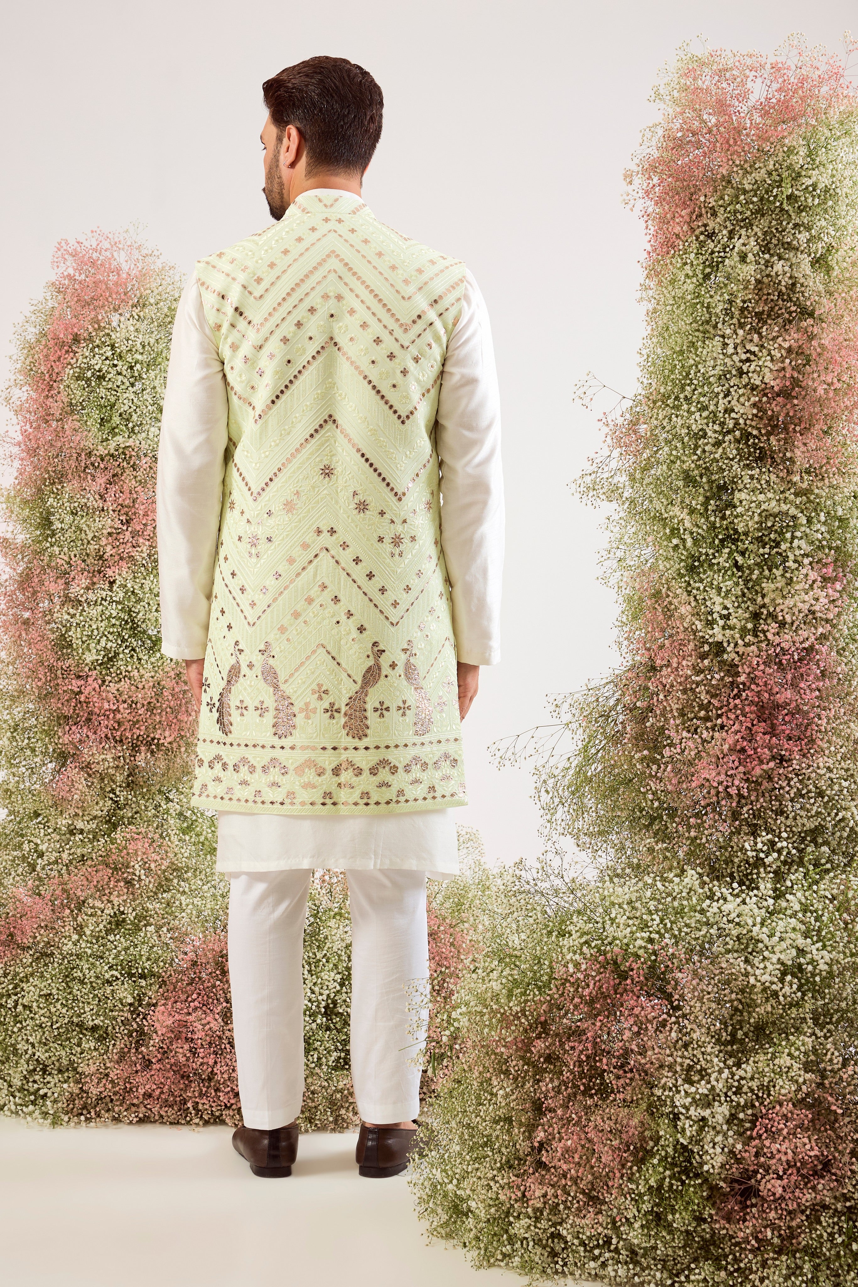 This magnificent green leather patchwork long open jacket is a true masterpiece of modern artistry.