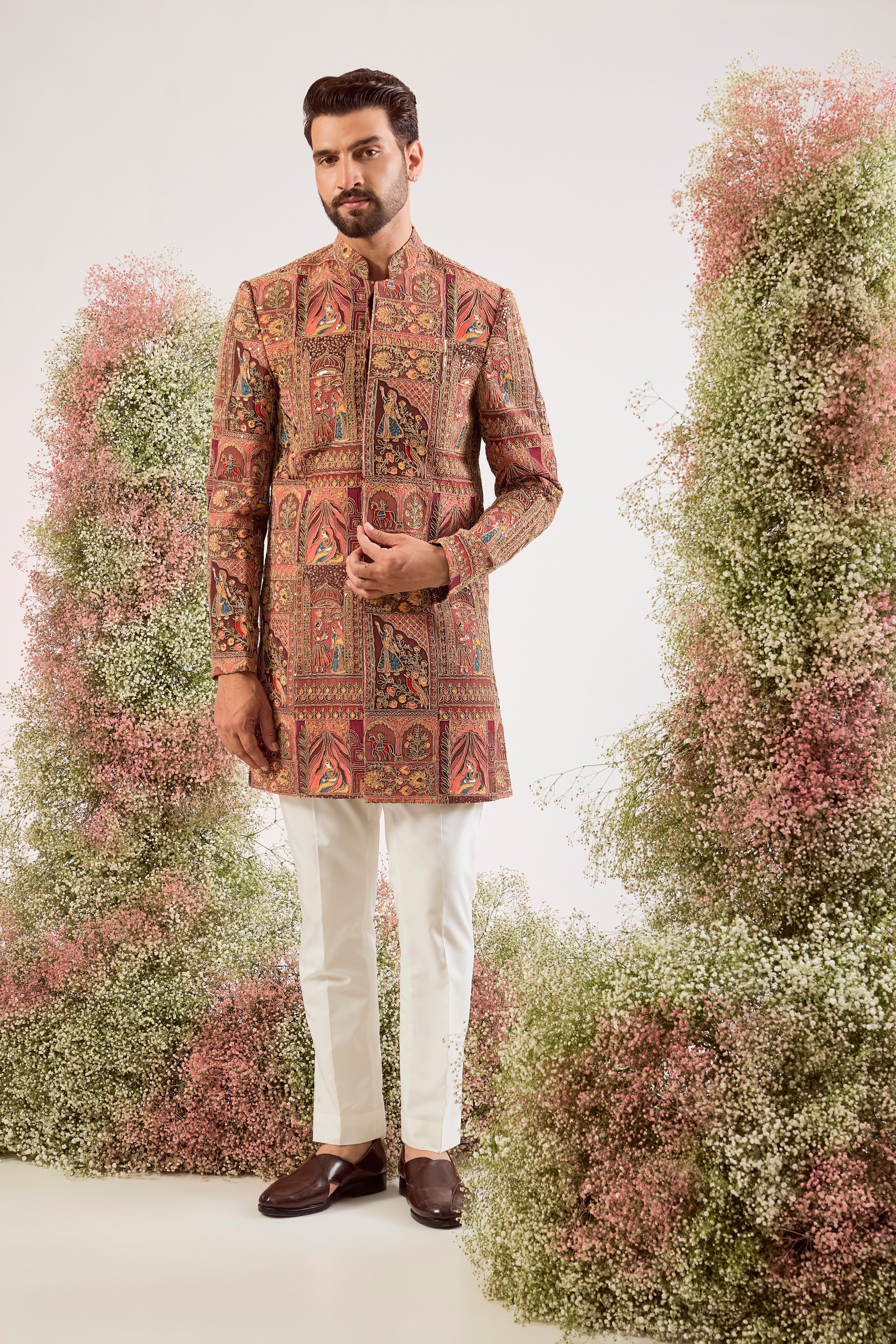 This magnificent mauve royal heritage short sherwani is a true masterpiece of traditional artistry and modern elegance