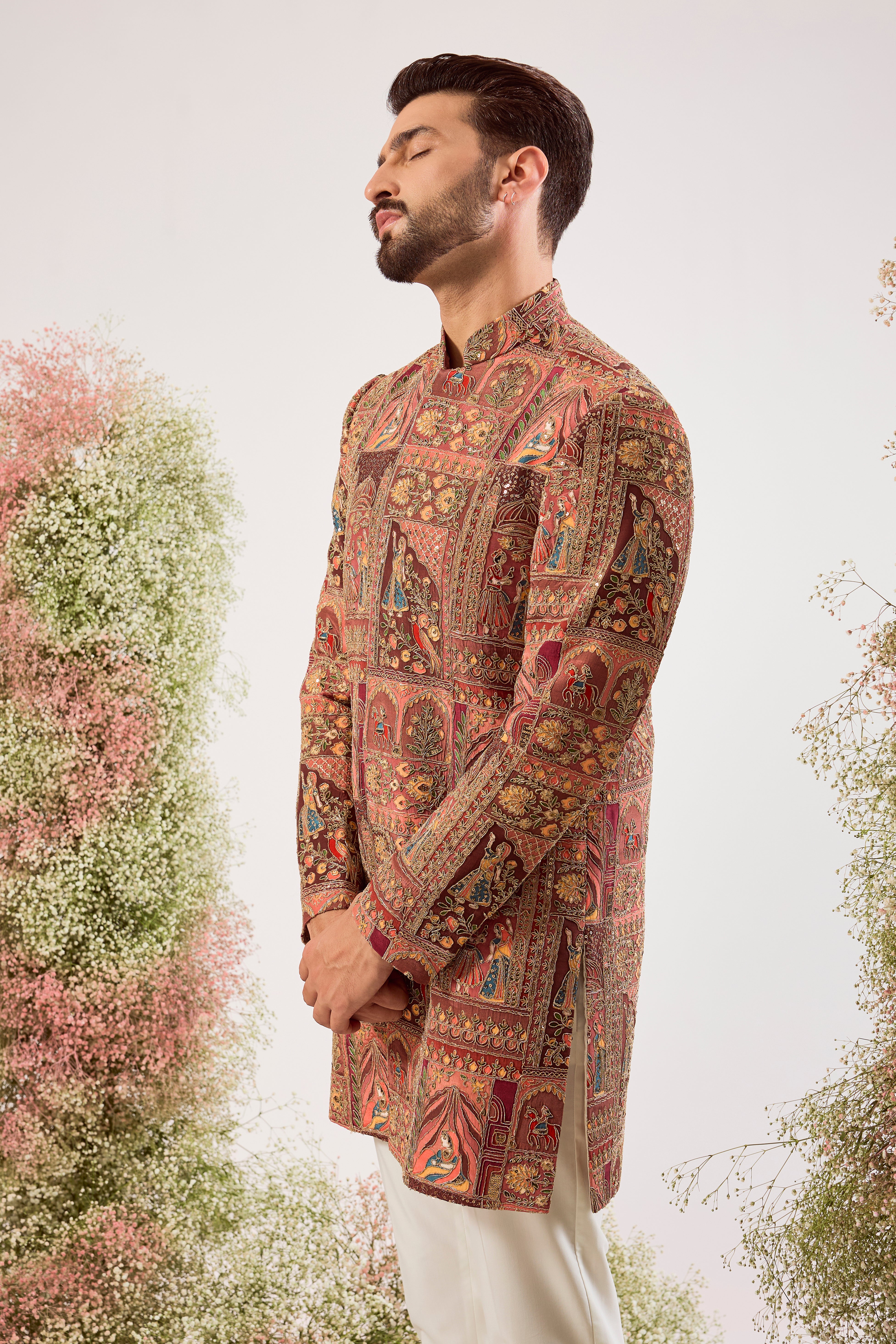 This magnificent mauve royal heritage short sherwani is a true masterpiece of traditional artistry and modern elegance