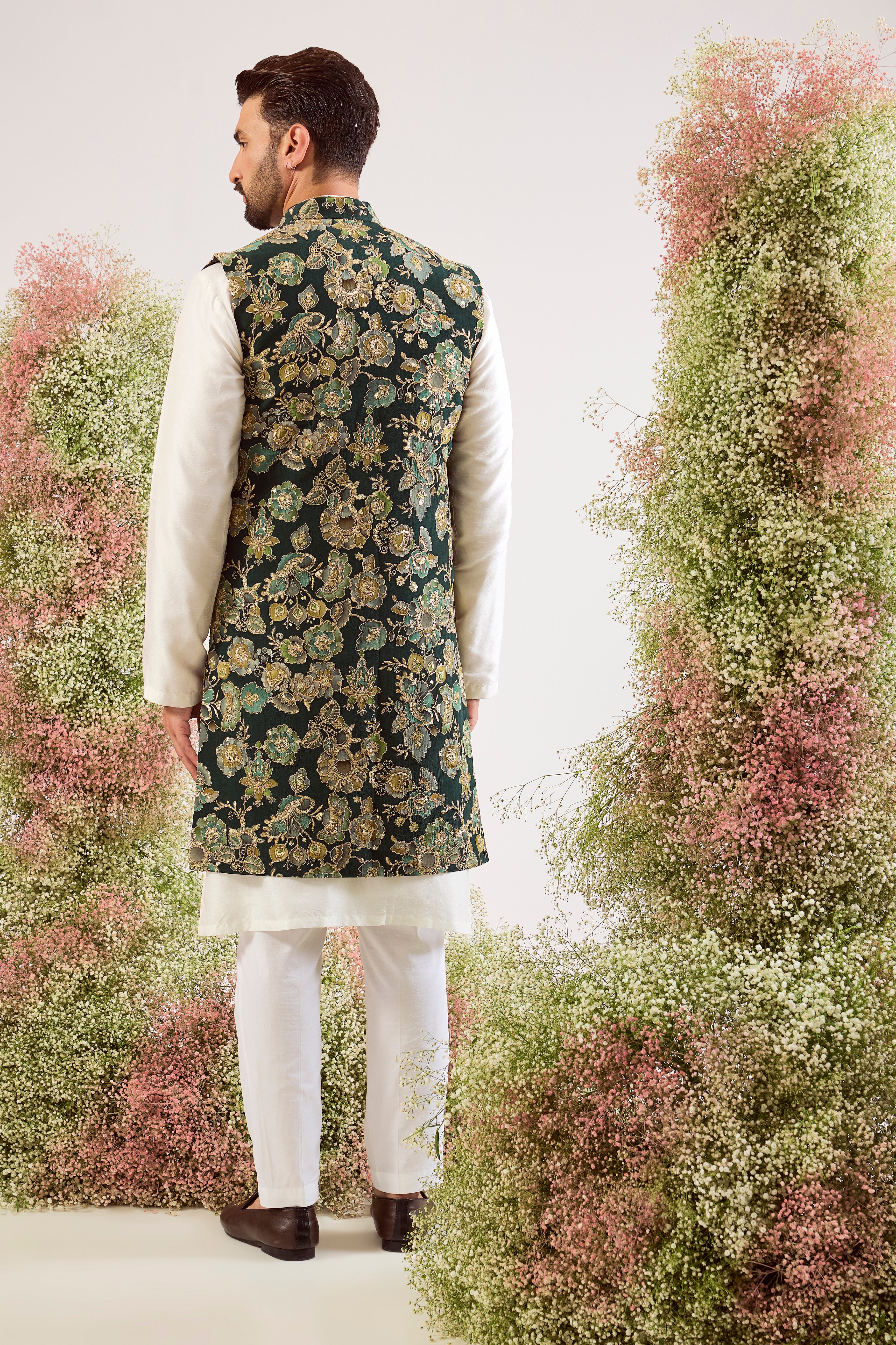 This magnificent green floral embroidered long open jacket is a masterpiece of timeless design and luxurious craftsmanship