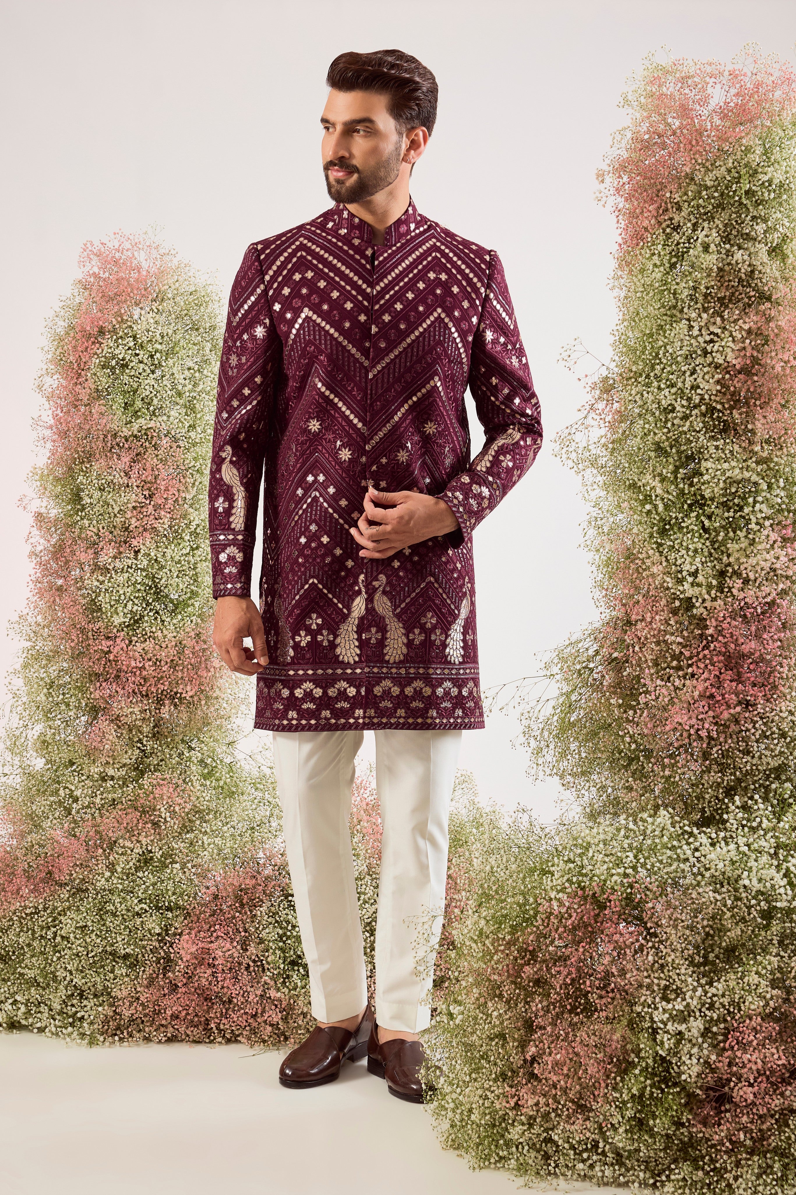 This majestic magenta short Indo-western is a true work of art, designed for the man who dares to be different.