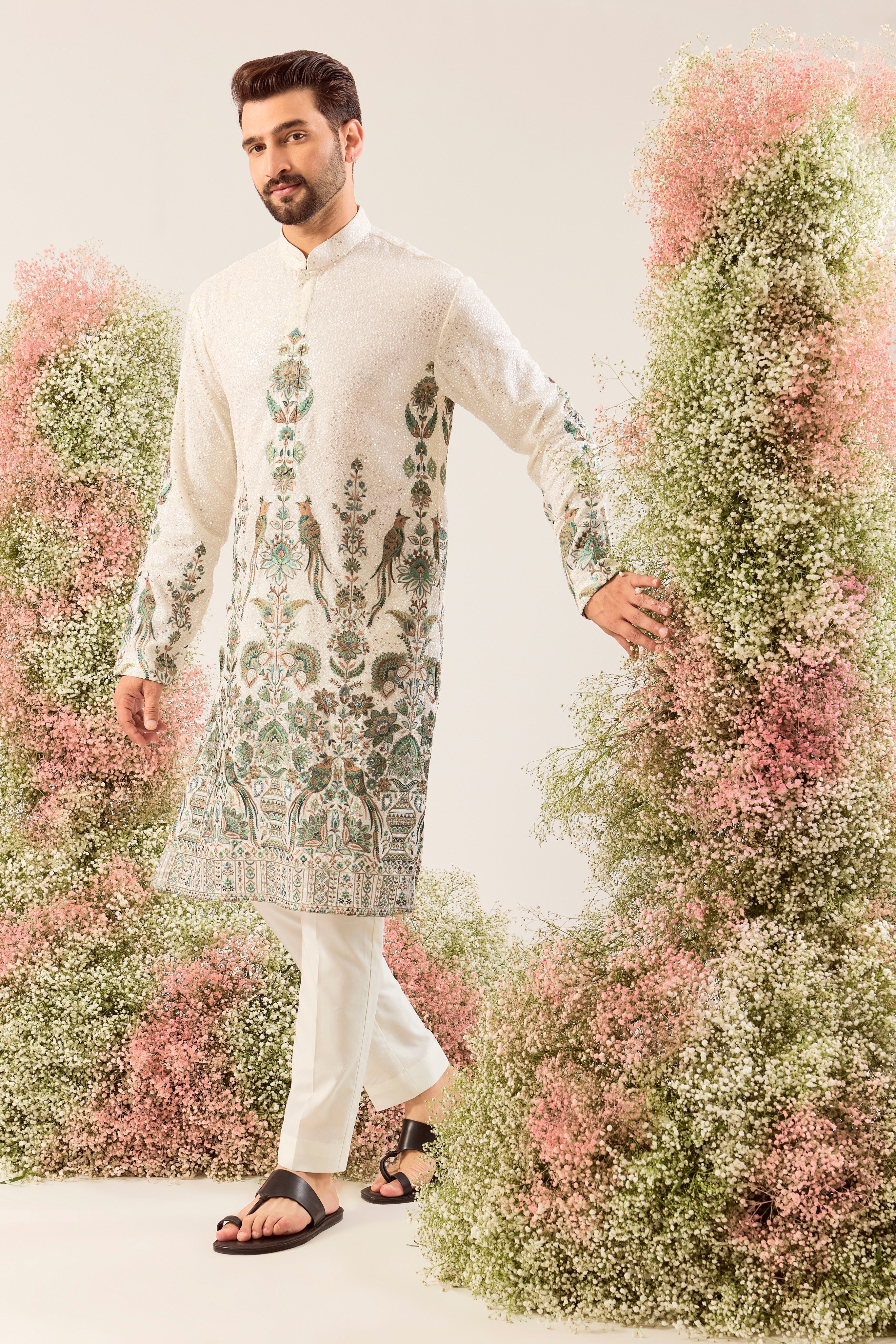 This exquisite white sequined kurta is a true masterpiece of refined artistry.