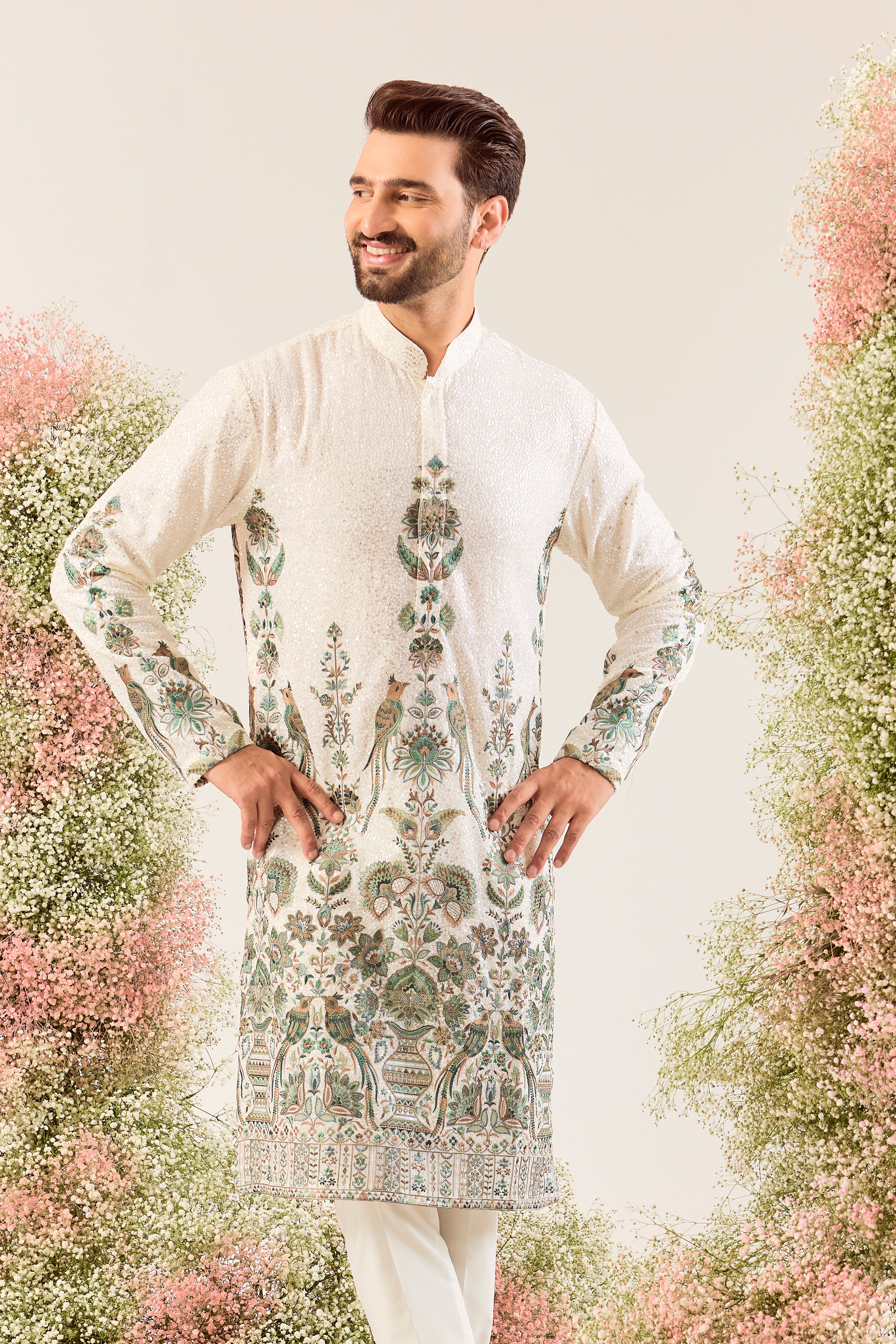 This exquisite white sequined kurta is a true masterpiece of refined artistry.