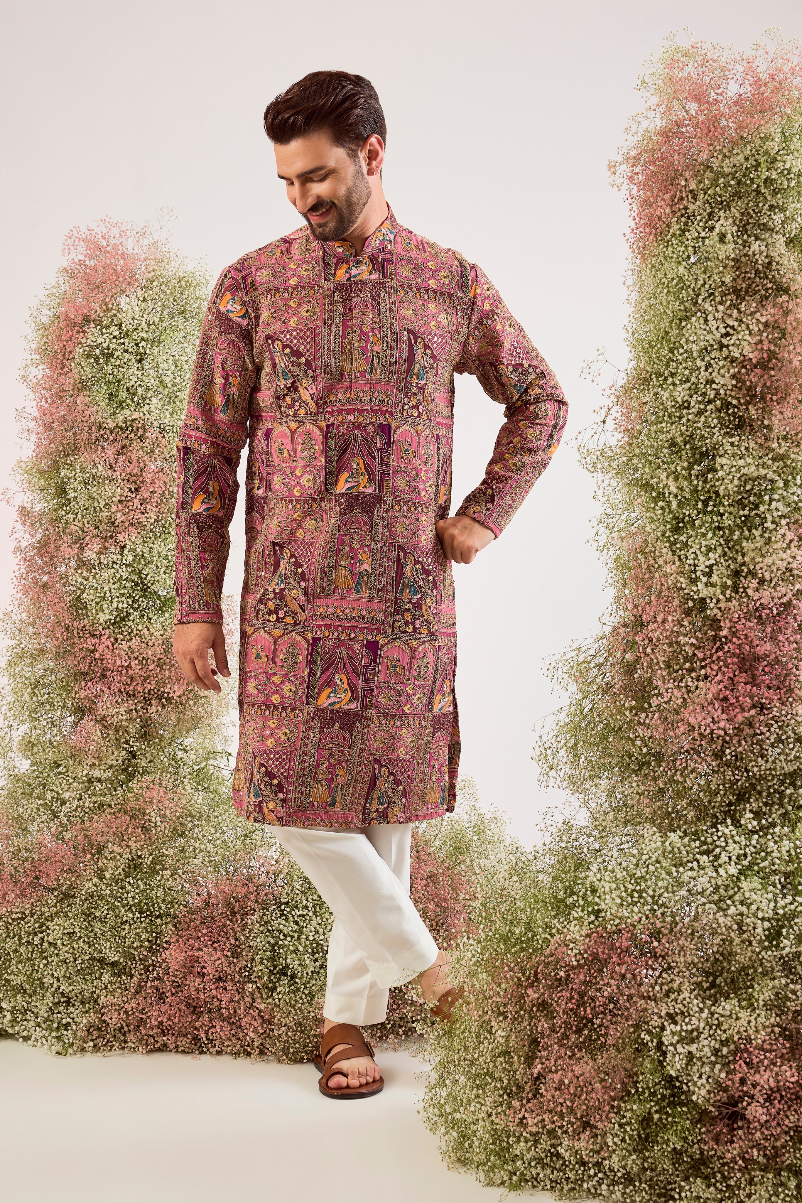 This regal purple royal heritage kurta is a true masterpiece of traditional artistry.