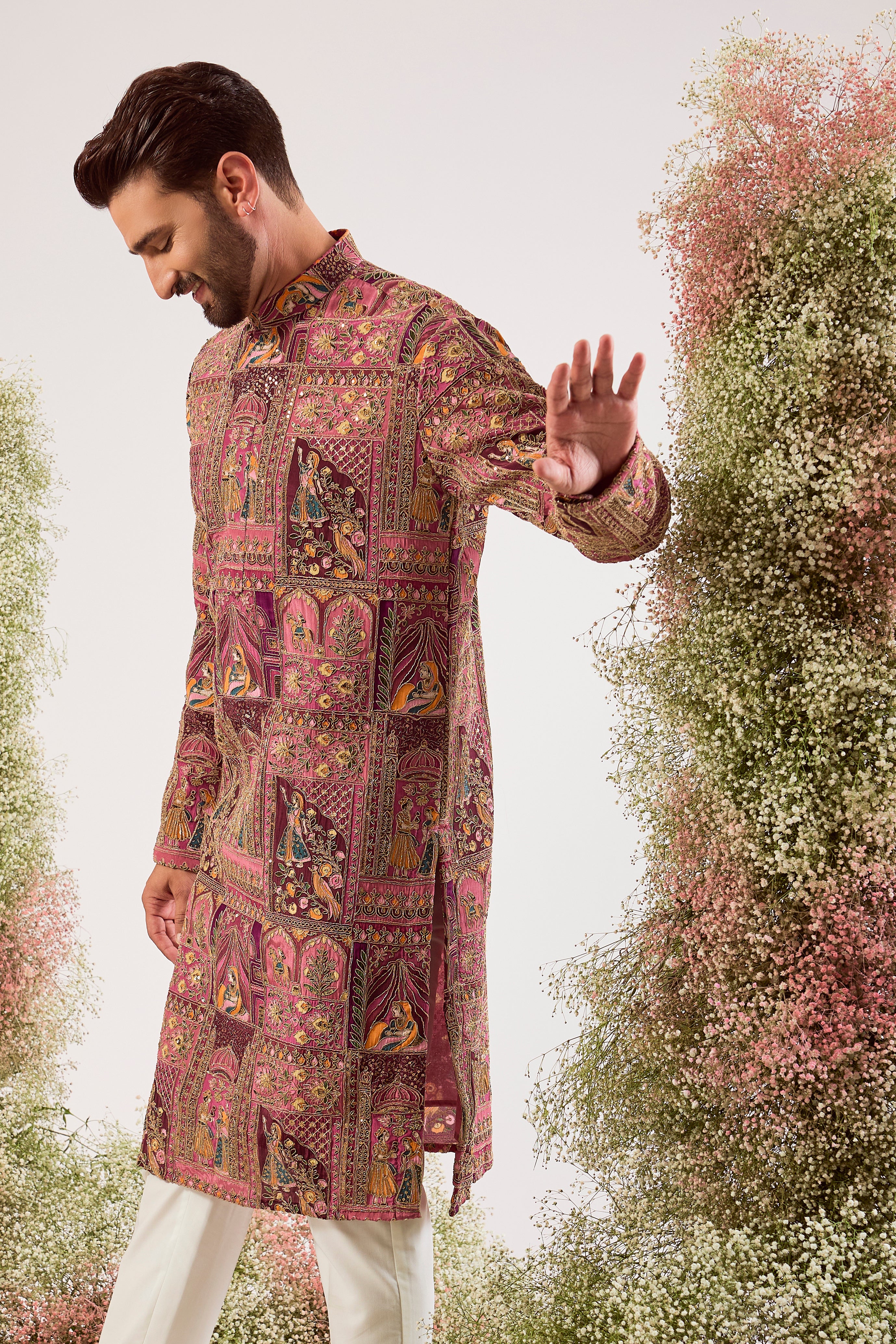 This regal purple royal heritage kurta is a true masterpiece of traditional artistry.