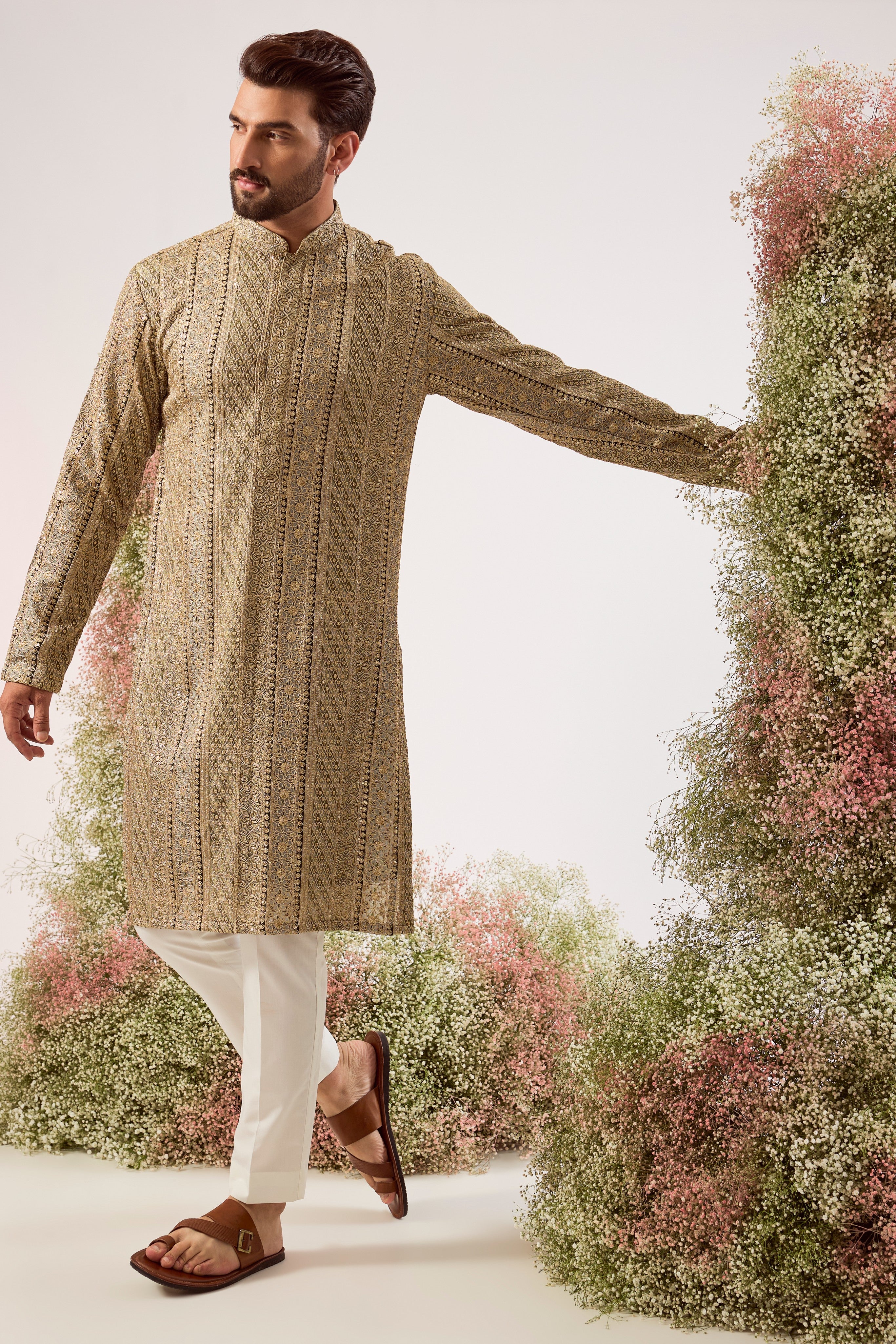 This striking mint green heavy zari work kurta is a masterpiece of modern luxury.