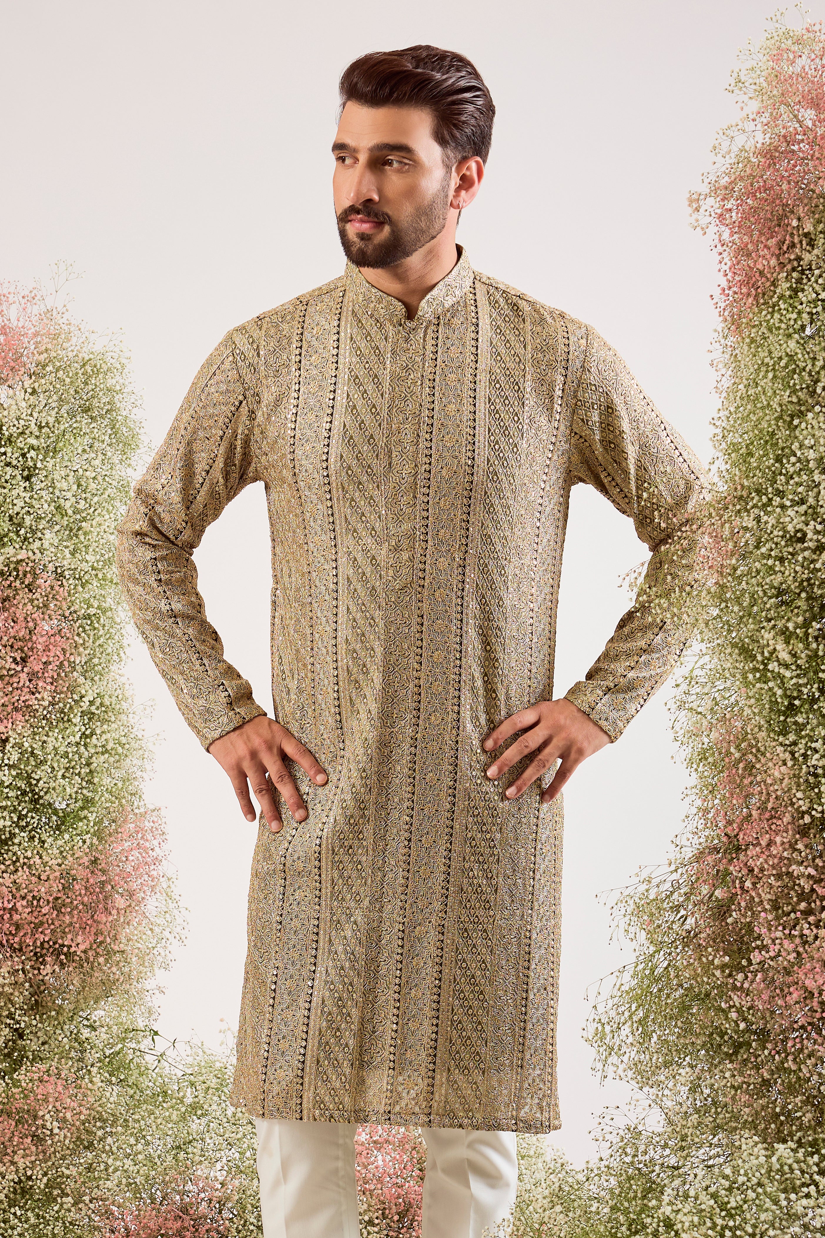 This striking mint green heavy zari work kurta is a masterpiece of modern luxury.