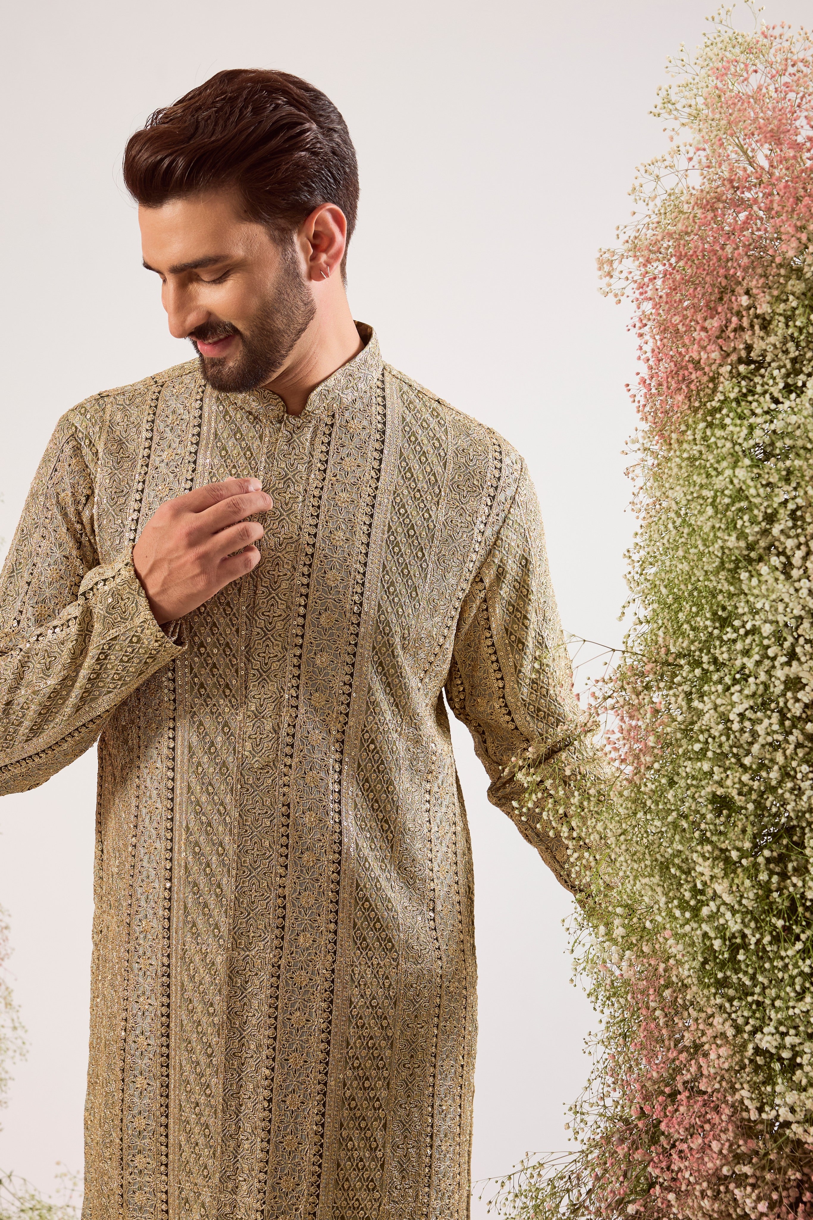 This striking mint green heavy zari work kurta is a masterpiece of modern luxury.