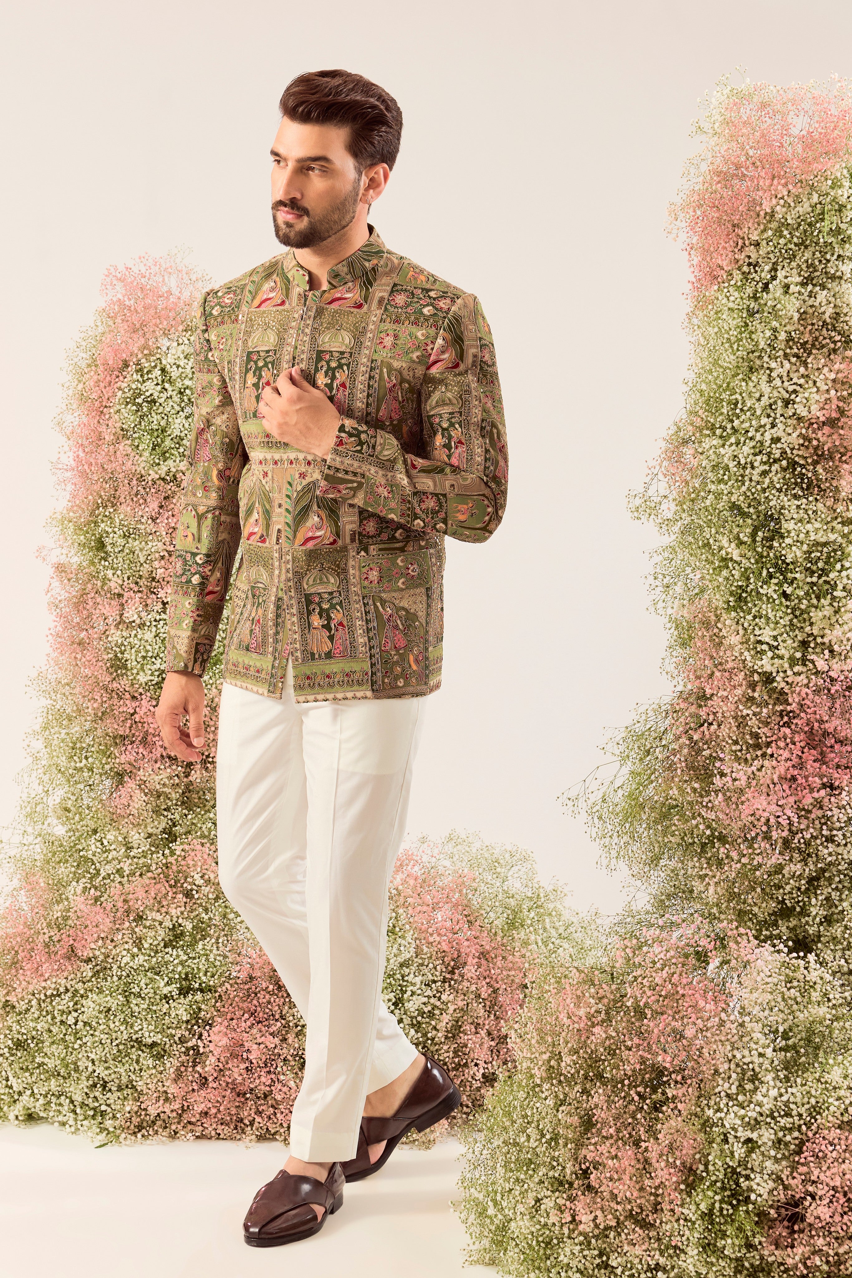 This striking green royal heritage bandhgala is a masterpiece of traditional artistry.