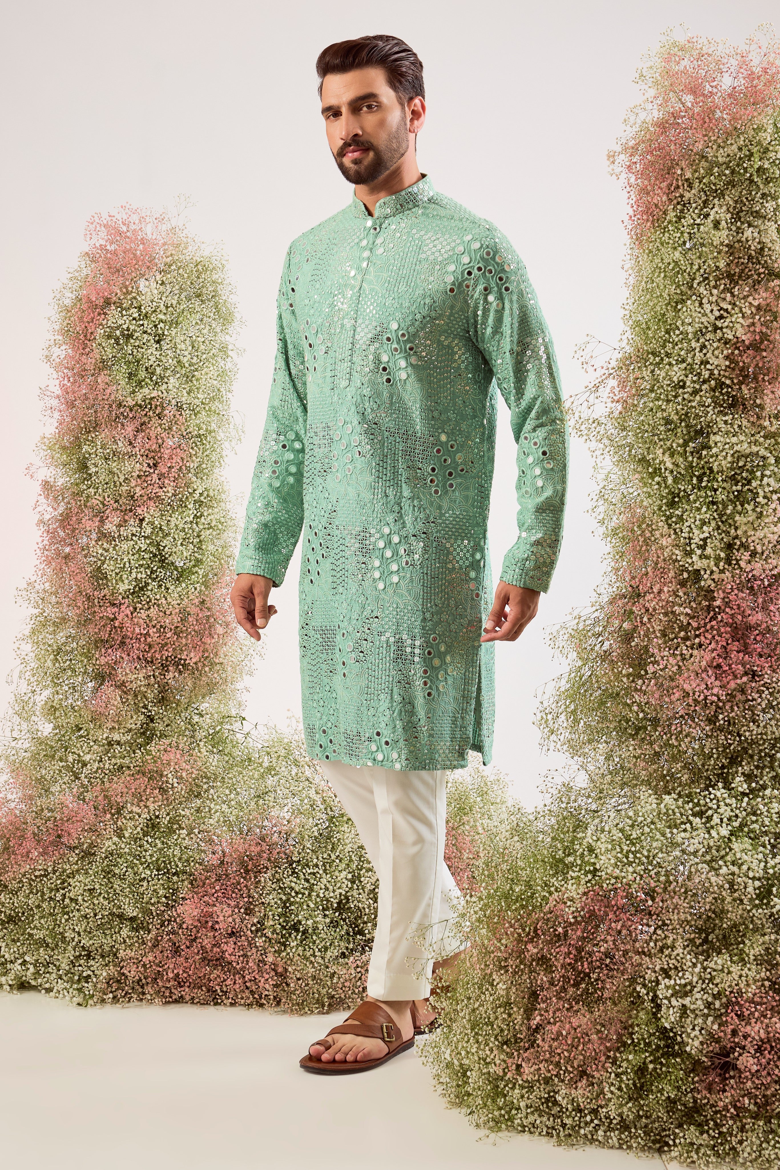sage green mirror work kurta with intricate floral embroidery and heavy sequin work
