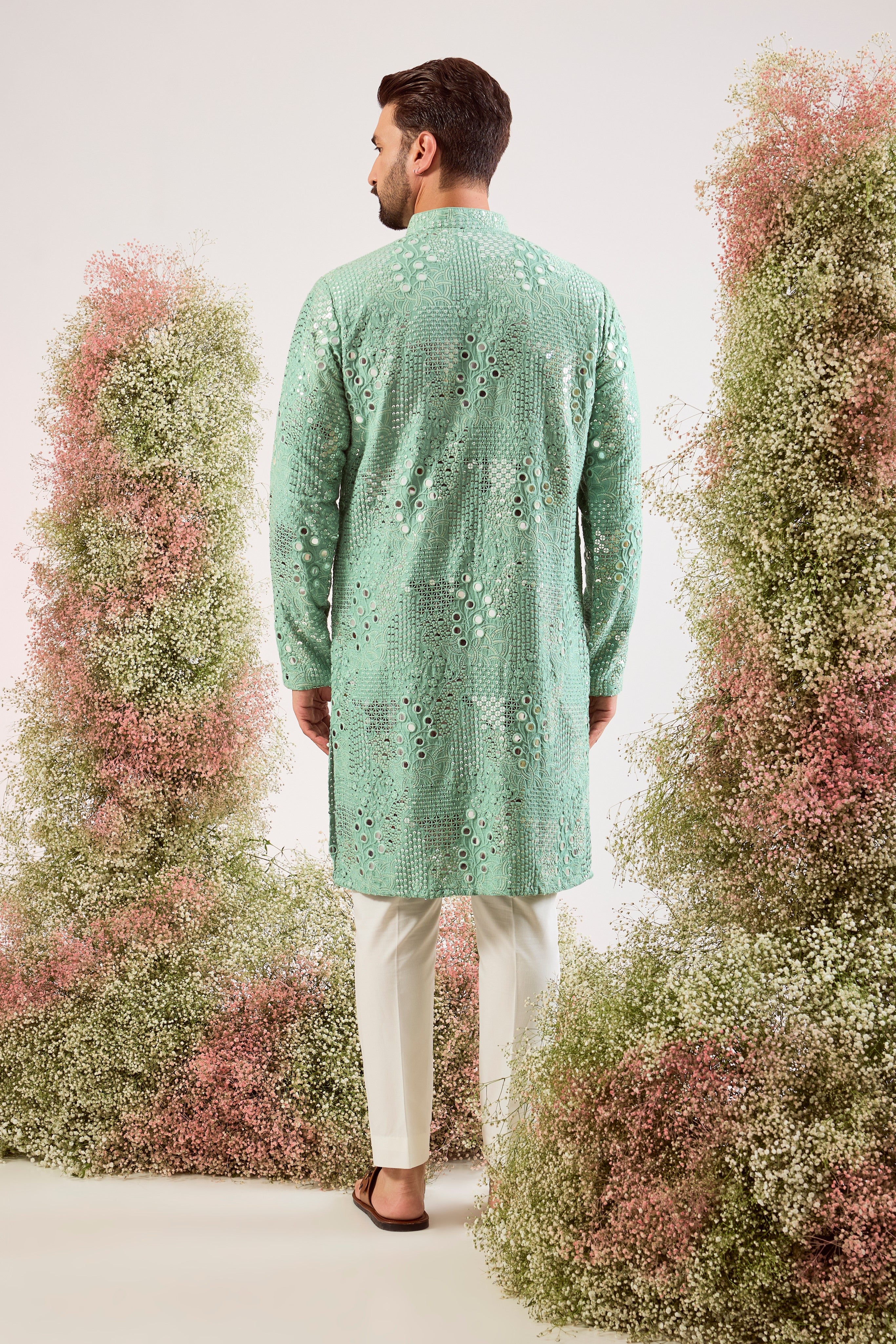sage green mirror work kurta with intricate floral embroidery and heavy sequin work