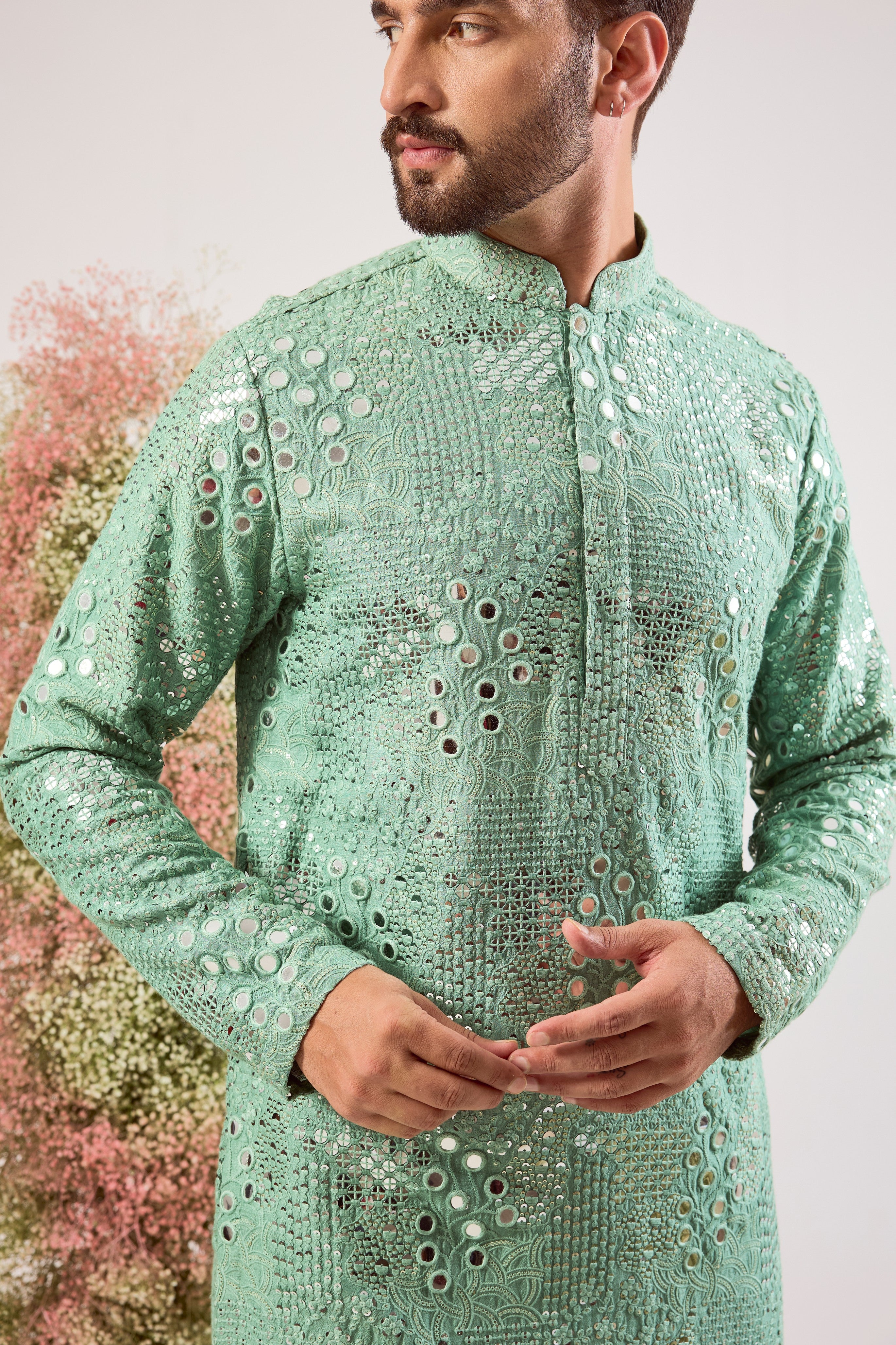 sage green mirror work kurta with intricate floral embroidery and heavy sequin work
