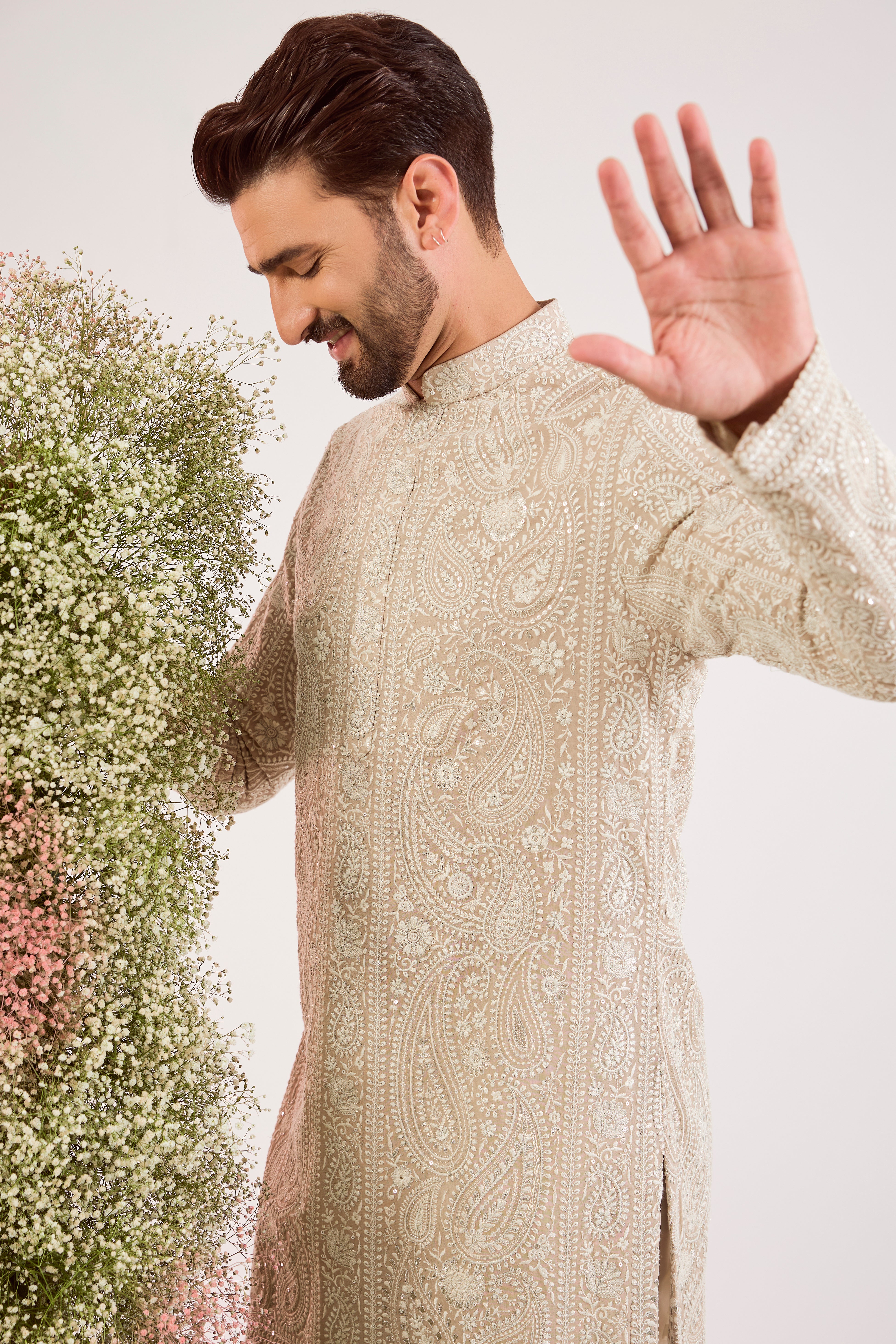 beige short chikankari kurta with delicate paisley  figures and sequin work