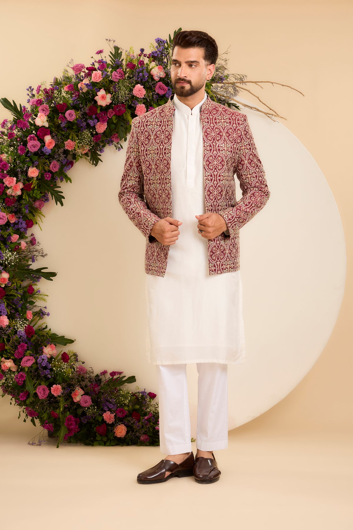 A Maroon Bandhgala Richly Embellished with threadwork
